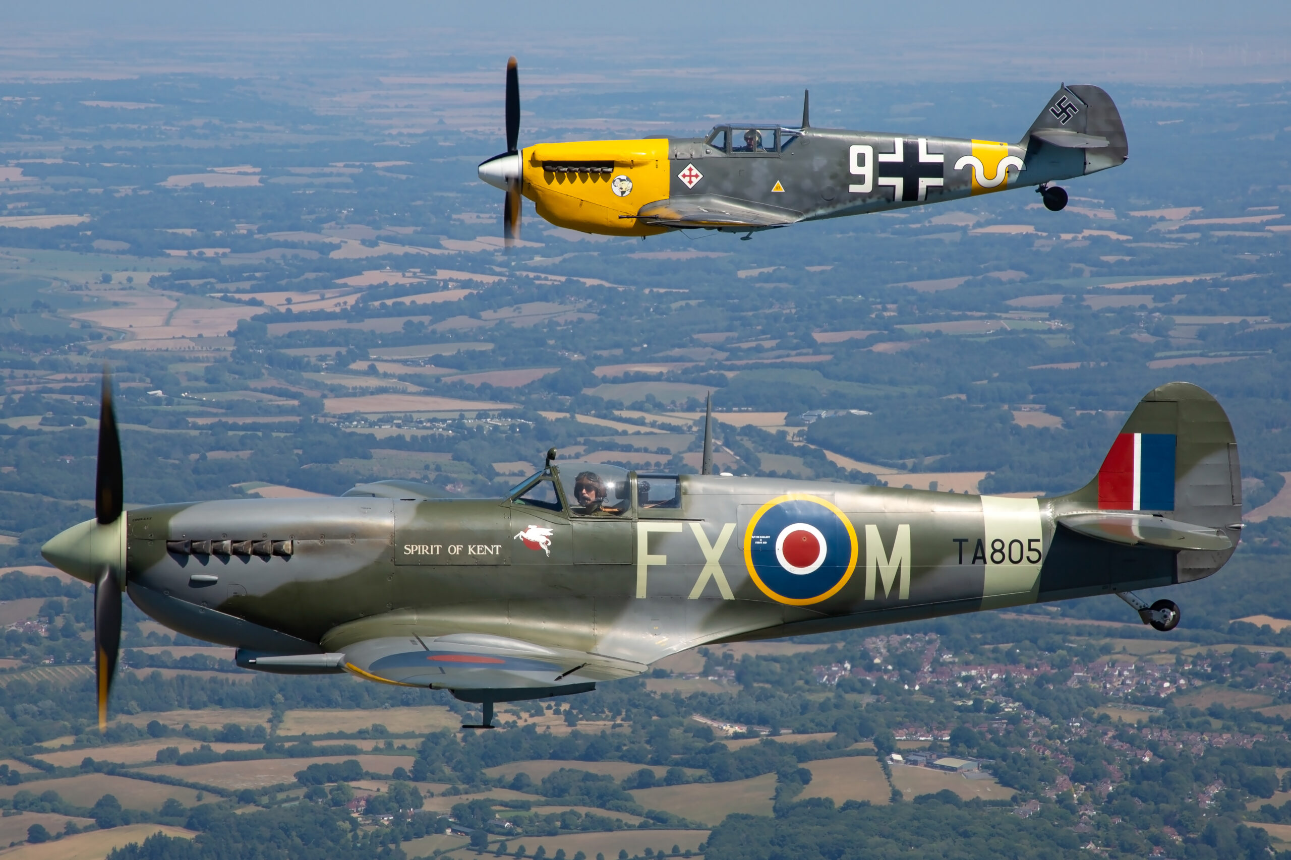 A Supermarine Spitfire banking against a clean sky at a UK warbirds display, an example of strong aviation photography composition, by Piemags Aviation.