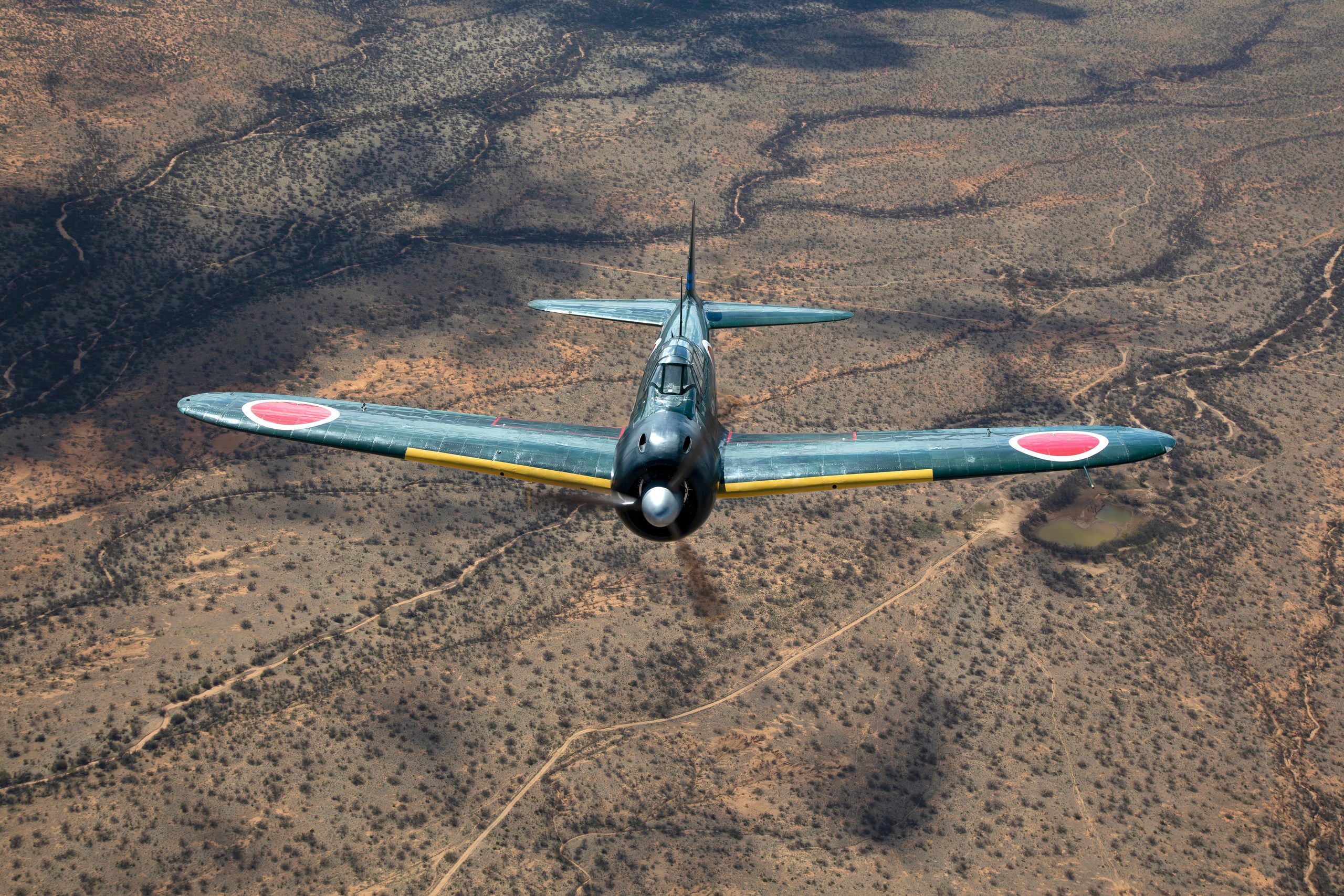 Mitsubishi A6M3 Zero topside over the Arizona desert, air to air