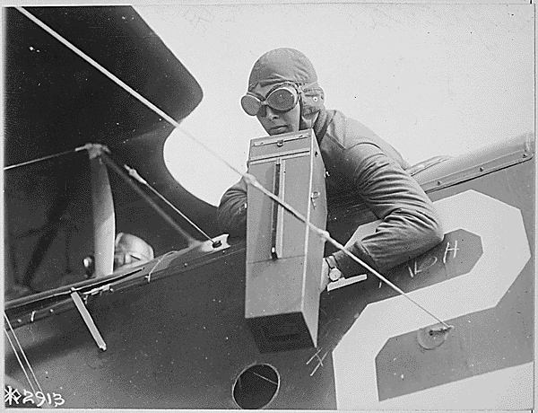 First World War airman operating a Graflex aerial camera from an aeroplane, circa 1917-18