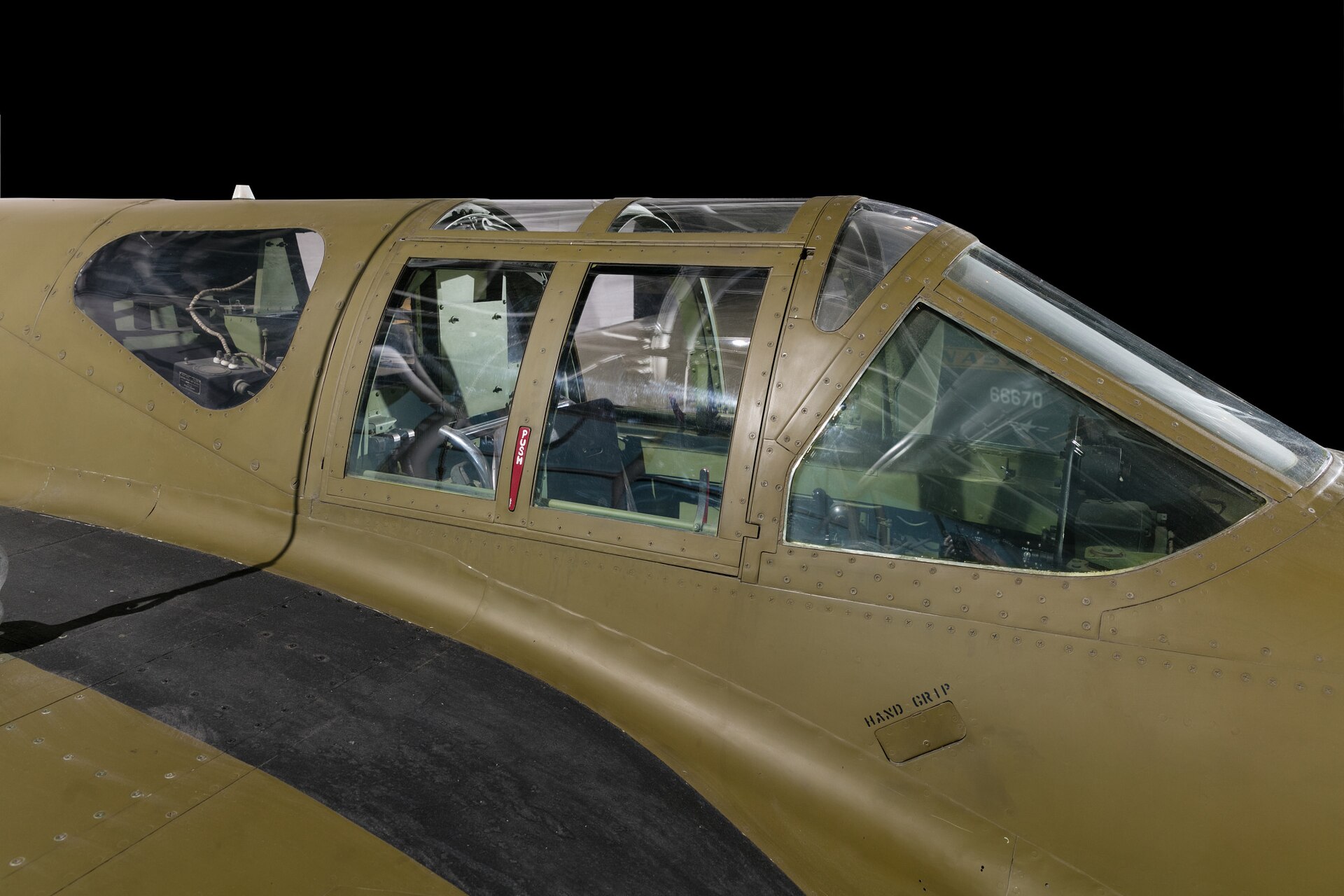 Open cockpit and instrument panel of a preserved aircraft in a museum