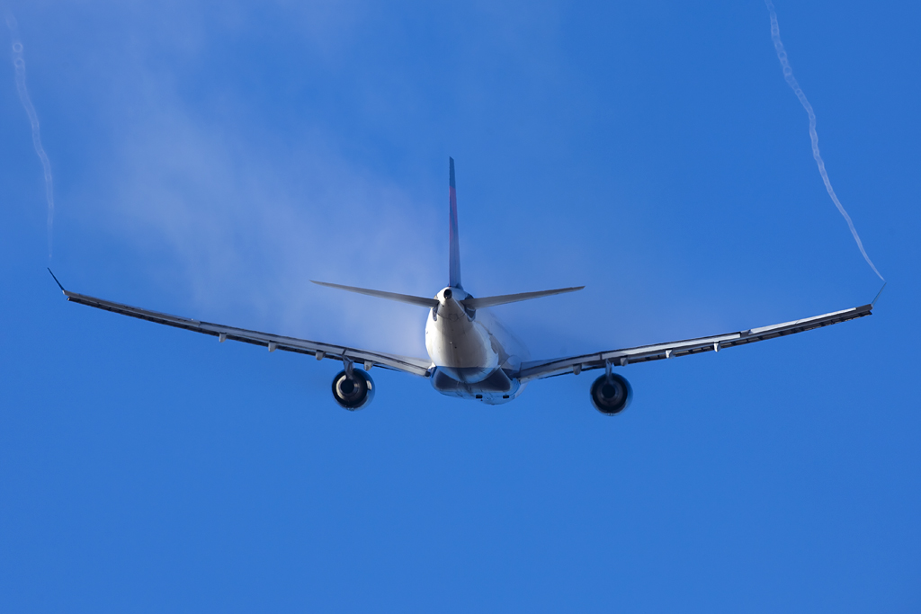 Condensation spiralling from an Airbus A330 wingtip on approach