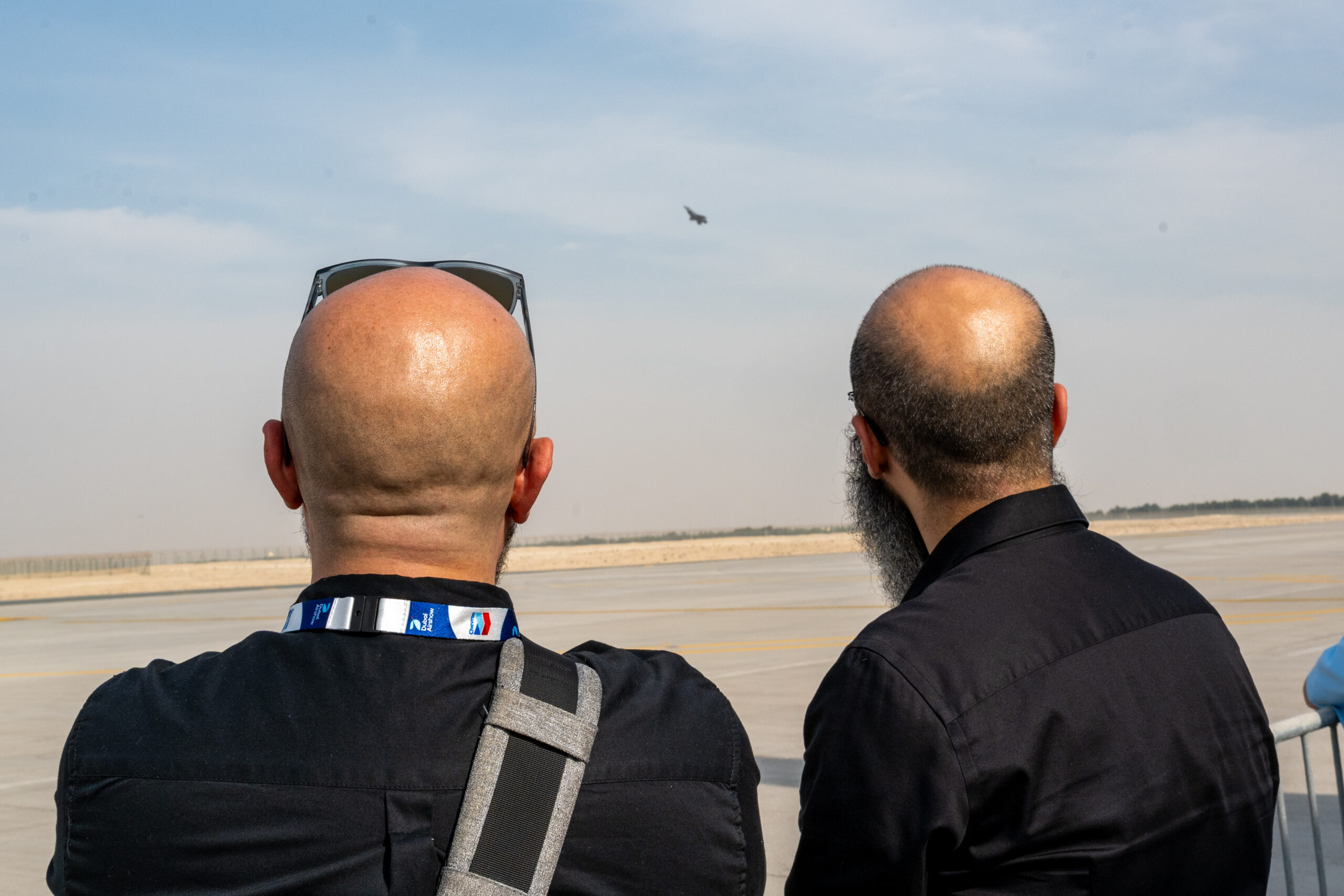 Spectators on the crowd line watching an aerial display at Dubai Airshow 2025