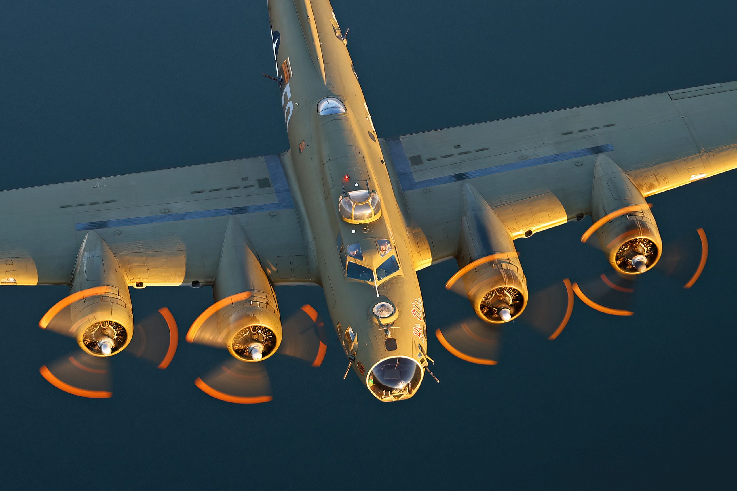B-17 Flying Fortress Ye Olde Pub from overhead showing nose glazing and engines, air to air