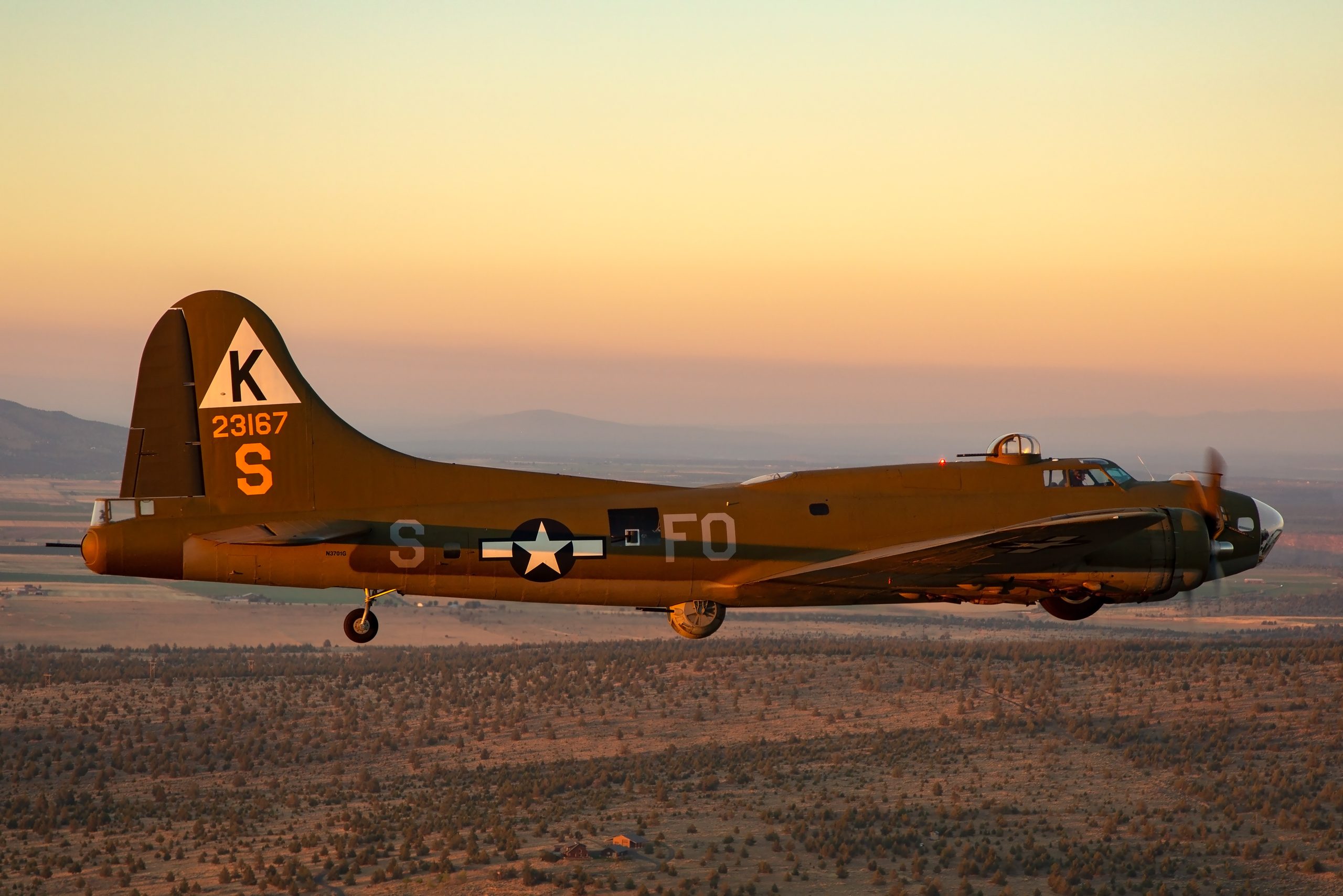 B-17 Flying Fortress Ye Olde Pub tail with serial 23167 and triangle K at sunset, air to air