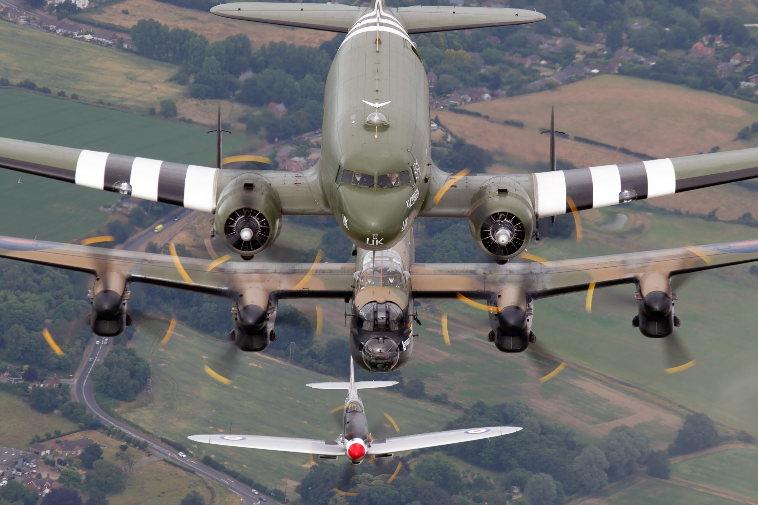 Battle of Britain Memorial Flight formation with C-47 Dakota, Avro Lancaster and Supermarine Spitfire stacked in flight