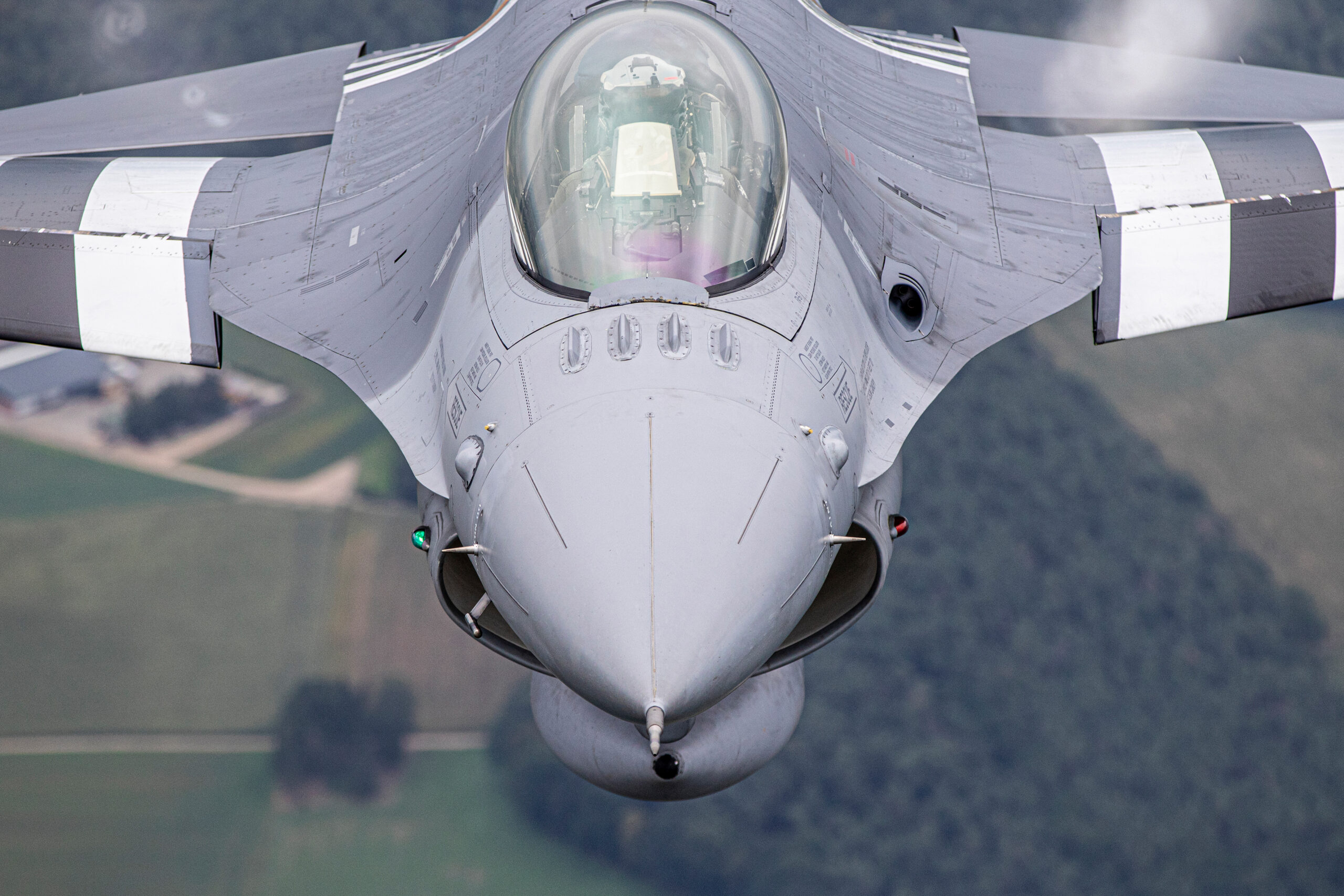 Close-up of the pilot of a Belgian Air Force F-16 air to air