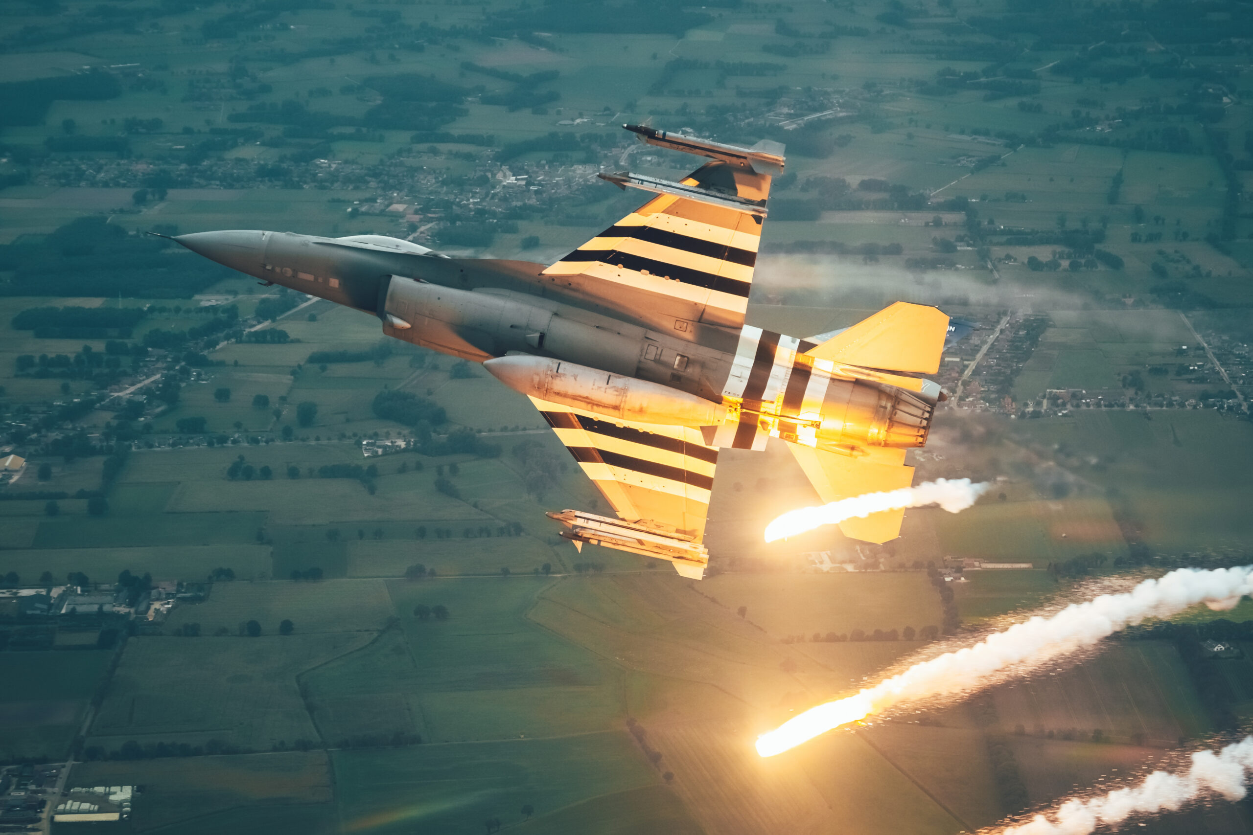 Belgian Air Force F-16 FA-57 topside with afterburner lit and flares