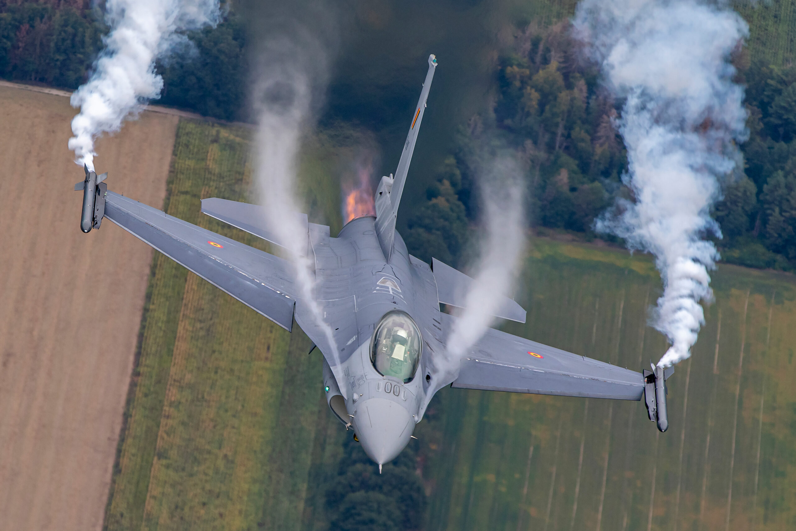 Belgian Air Force F-16 head-on with condensation vapour over the fuselage