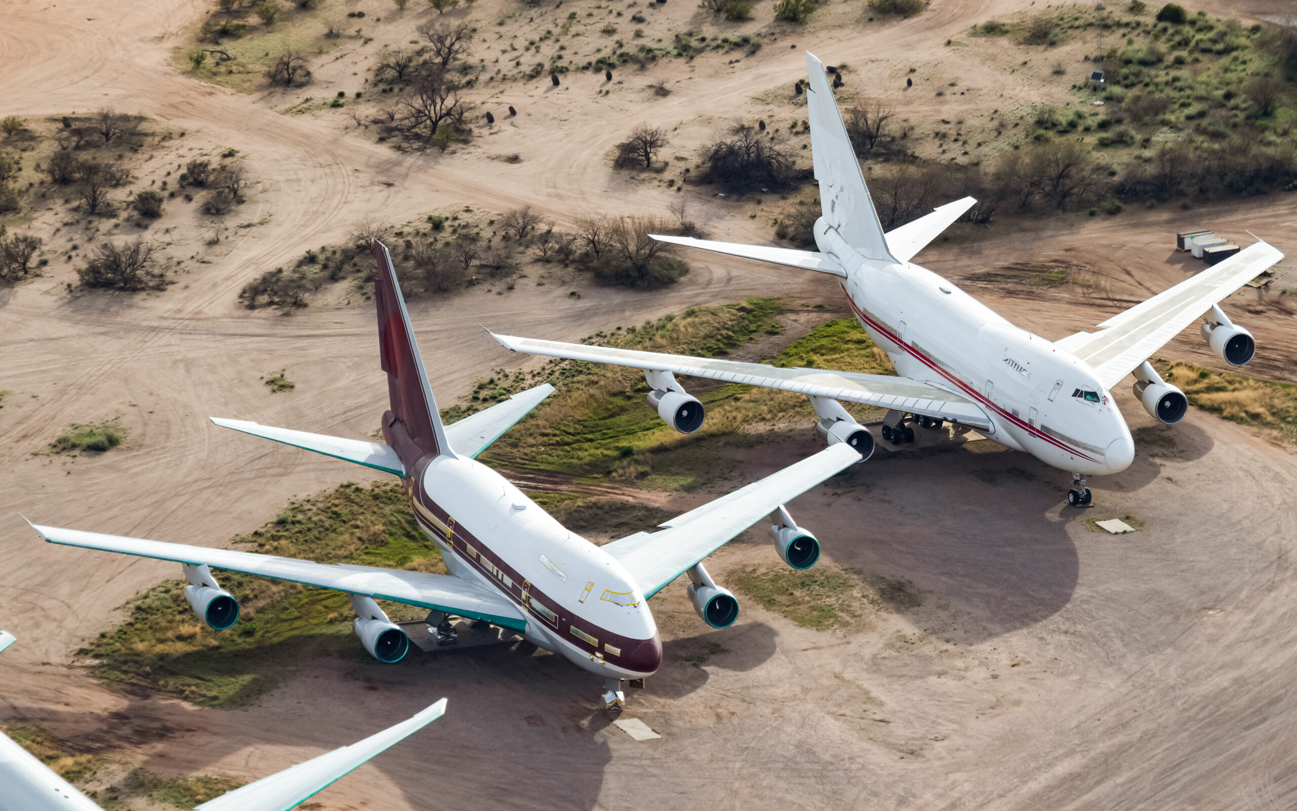 Boeing 747SP-21 VP-BAT and Boeing 747SP-31 P4-FSH parked together in storage at Pinal Airpark, Arizona