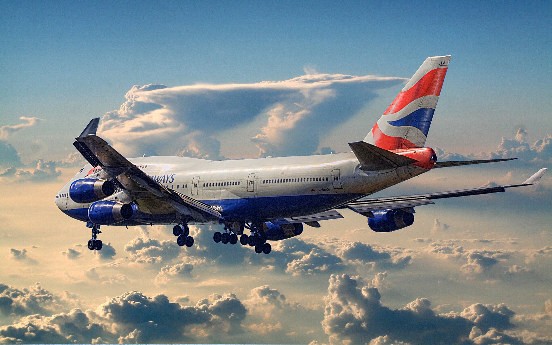 British Airways Boeing 747-400 climbing out with dramatic clouds behind