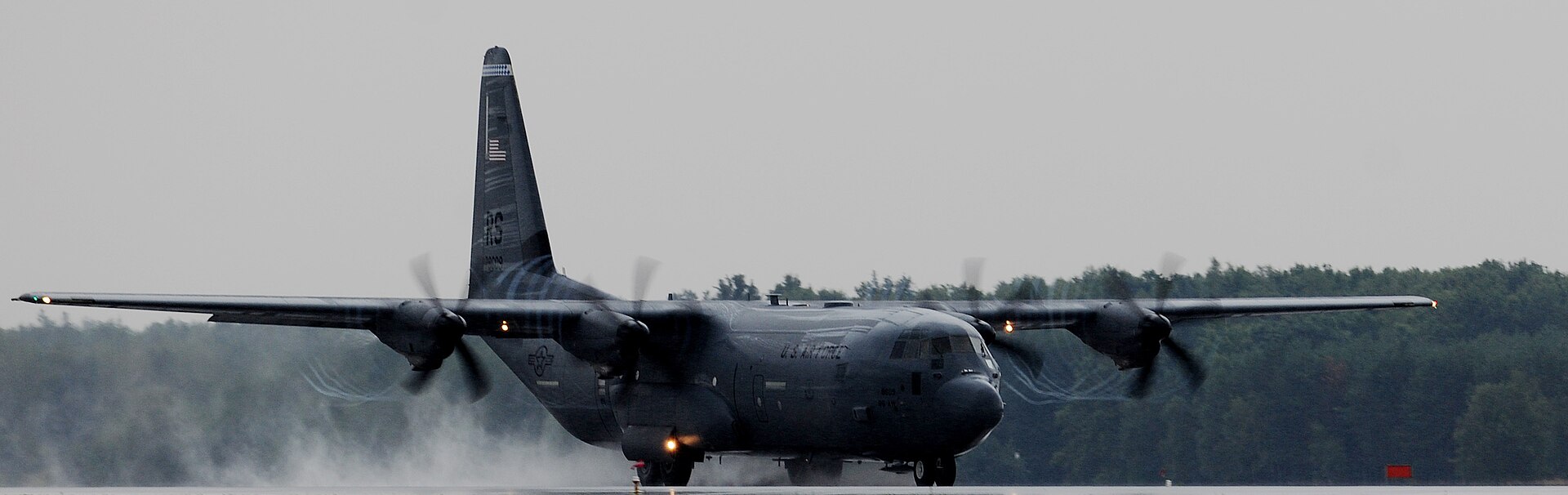 US Air Force C-130 Hercules transports flying through cloud
