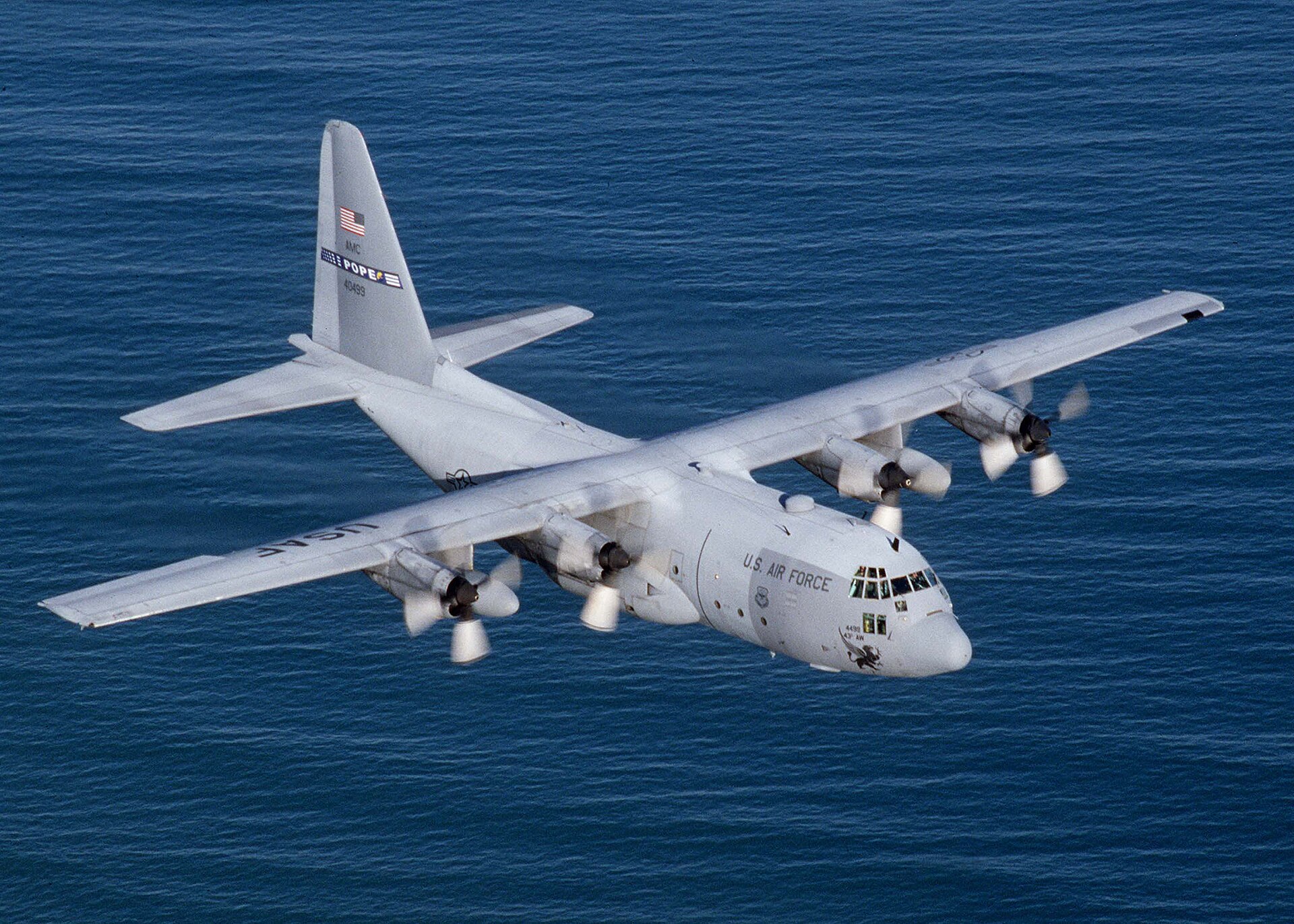 A Lockheed C-130 Hercules military transport aircraft in flight