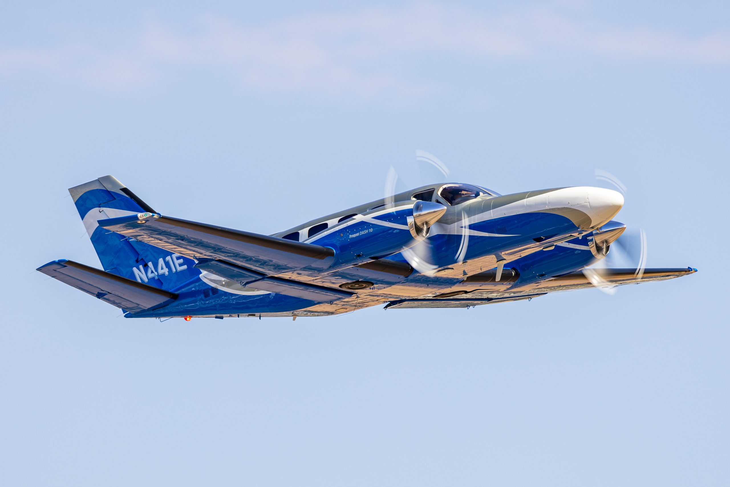 Cessna 441 Conquest banking with propellers turning
