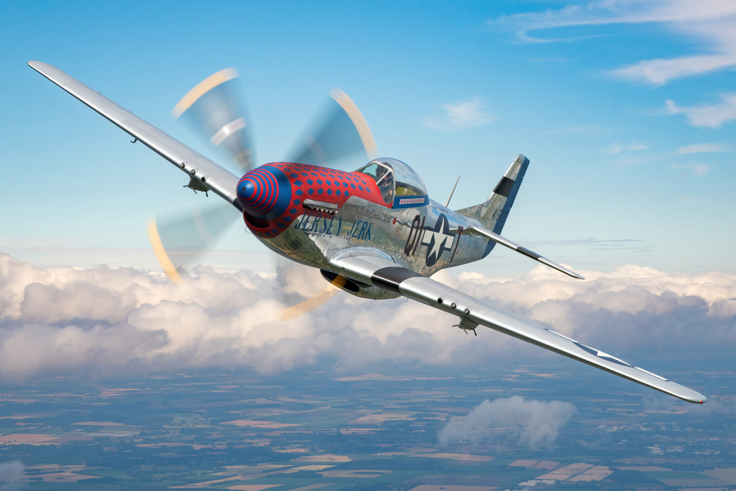 Commonwealth CA-18 Mustang Mk.21 in flight with its propeller blurred into a full disc