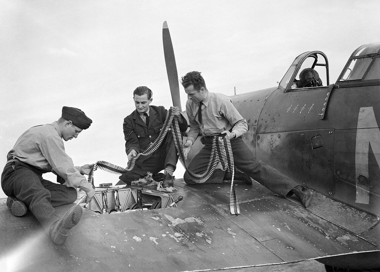 Armourers replenish ammunition in a Hurricane of No. 310 Czechoslovak Squadron at Duxford, 7 September 1940