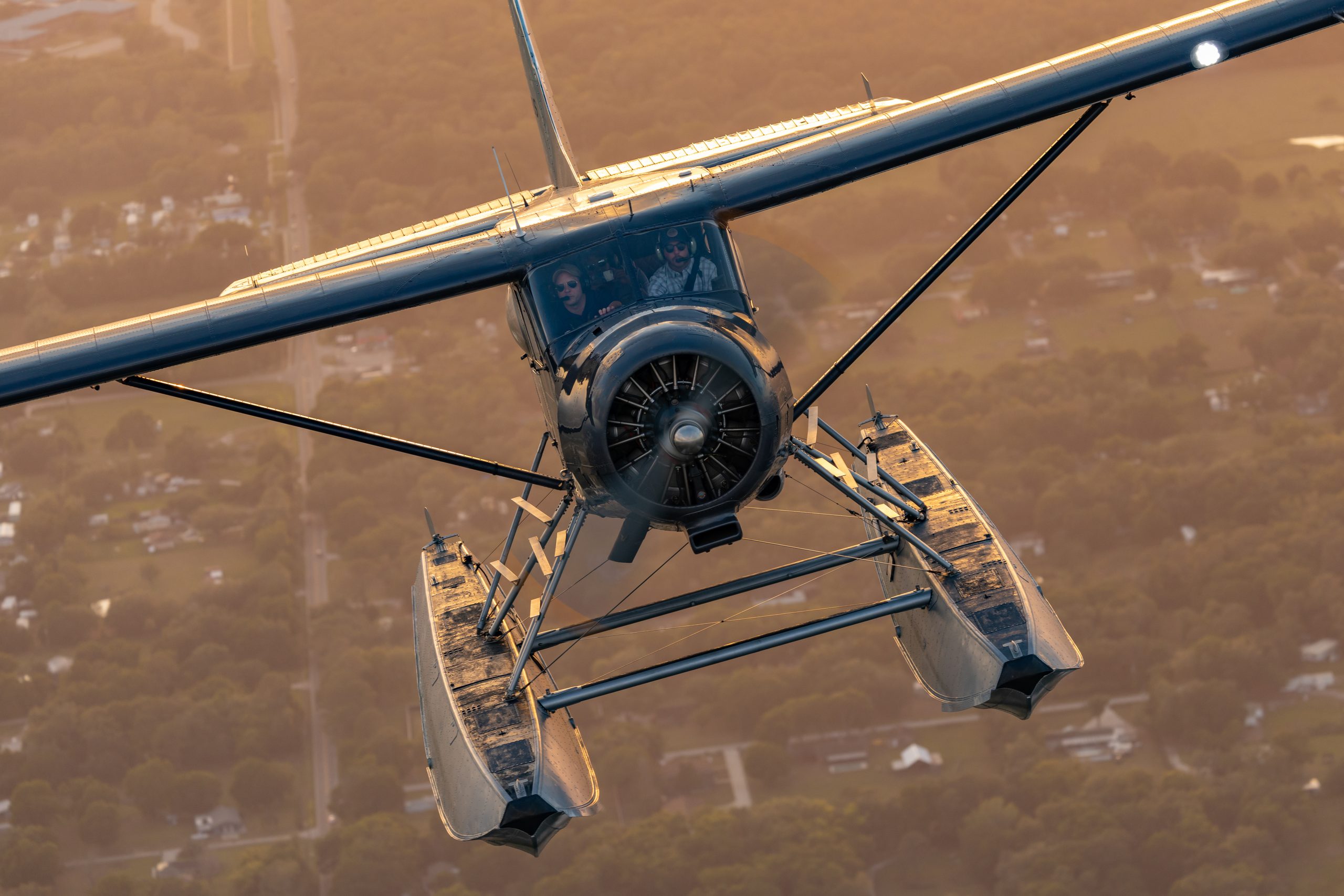 DHC-2 Beaver floatplane head-on in golden hour light