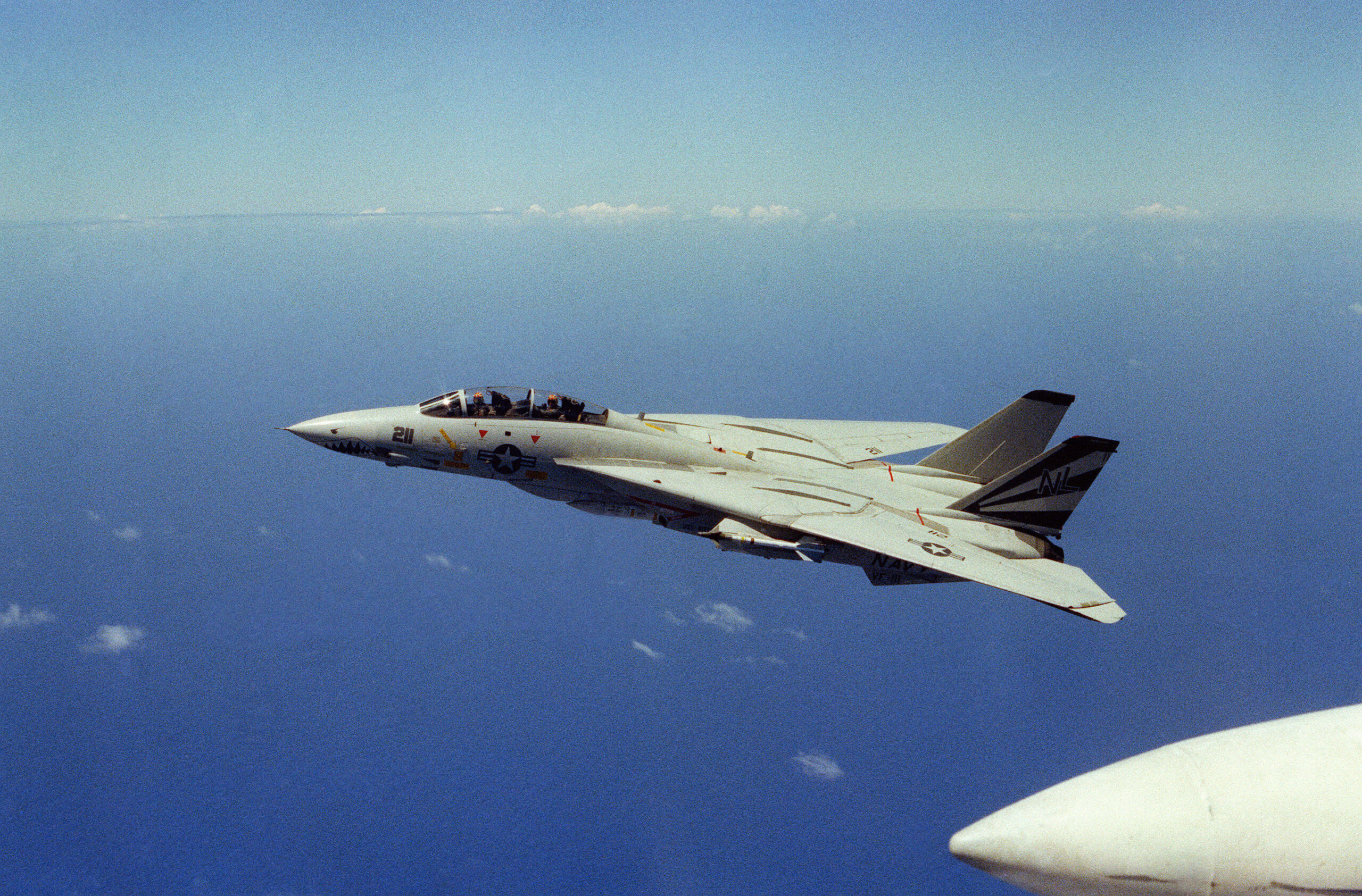 F-14A Tomcat of VF-111 flying with wings fully swept back in 1983