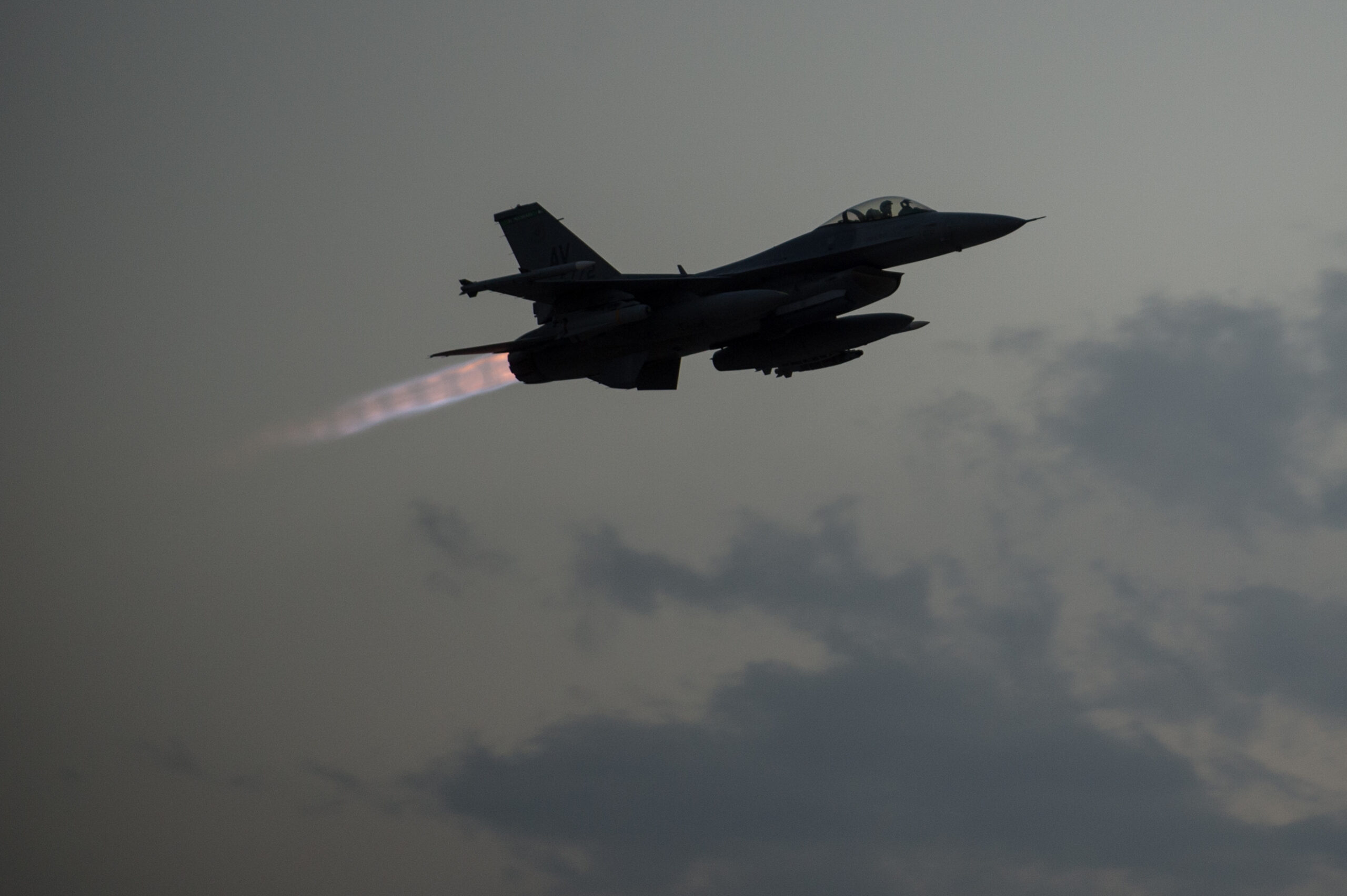 US Air Force F-16 Fighting Falcon taking off from Bagram Air Field at sunset