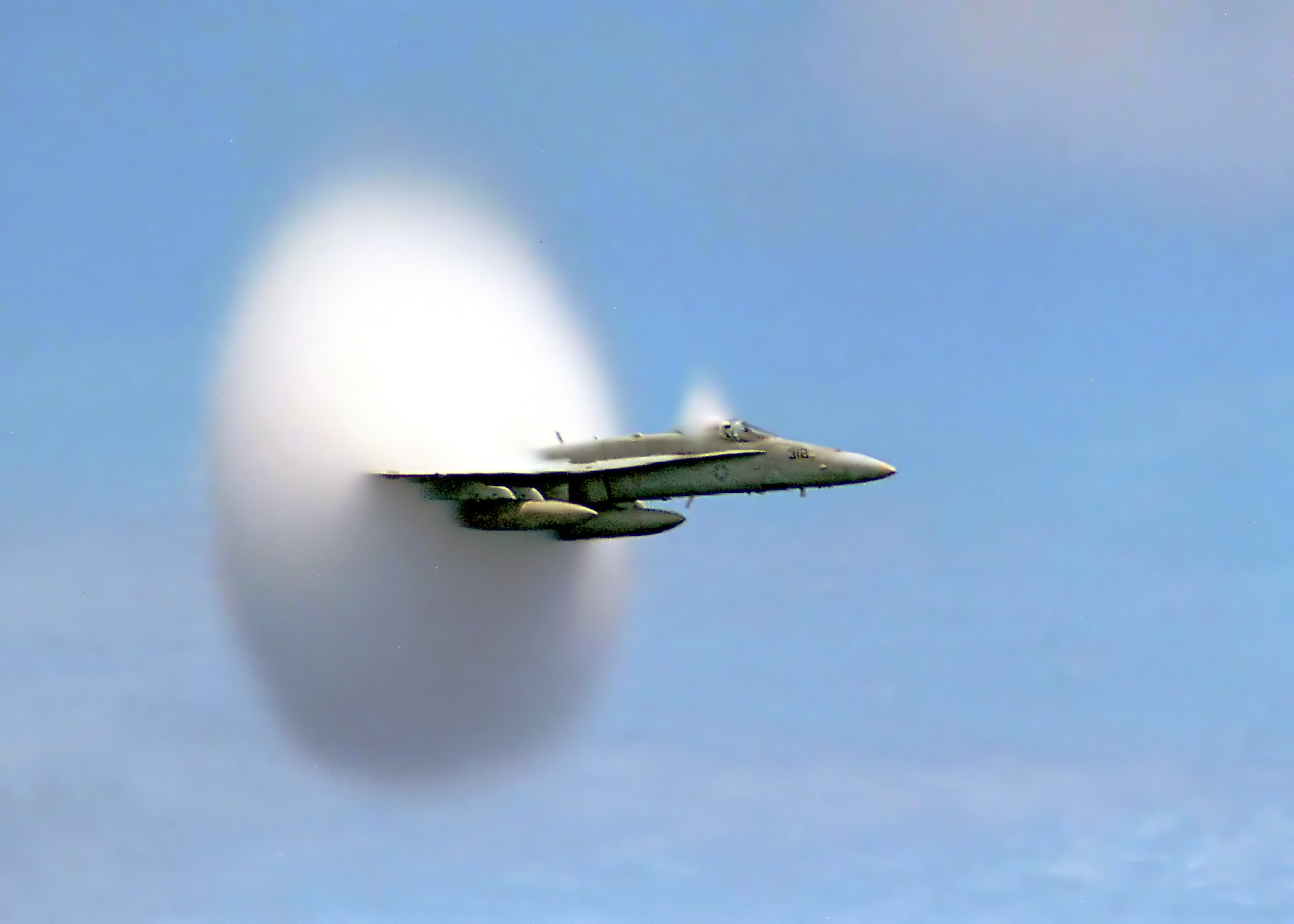 F/A-18 Hornet enveloped in a transonic condensation cloud