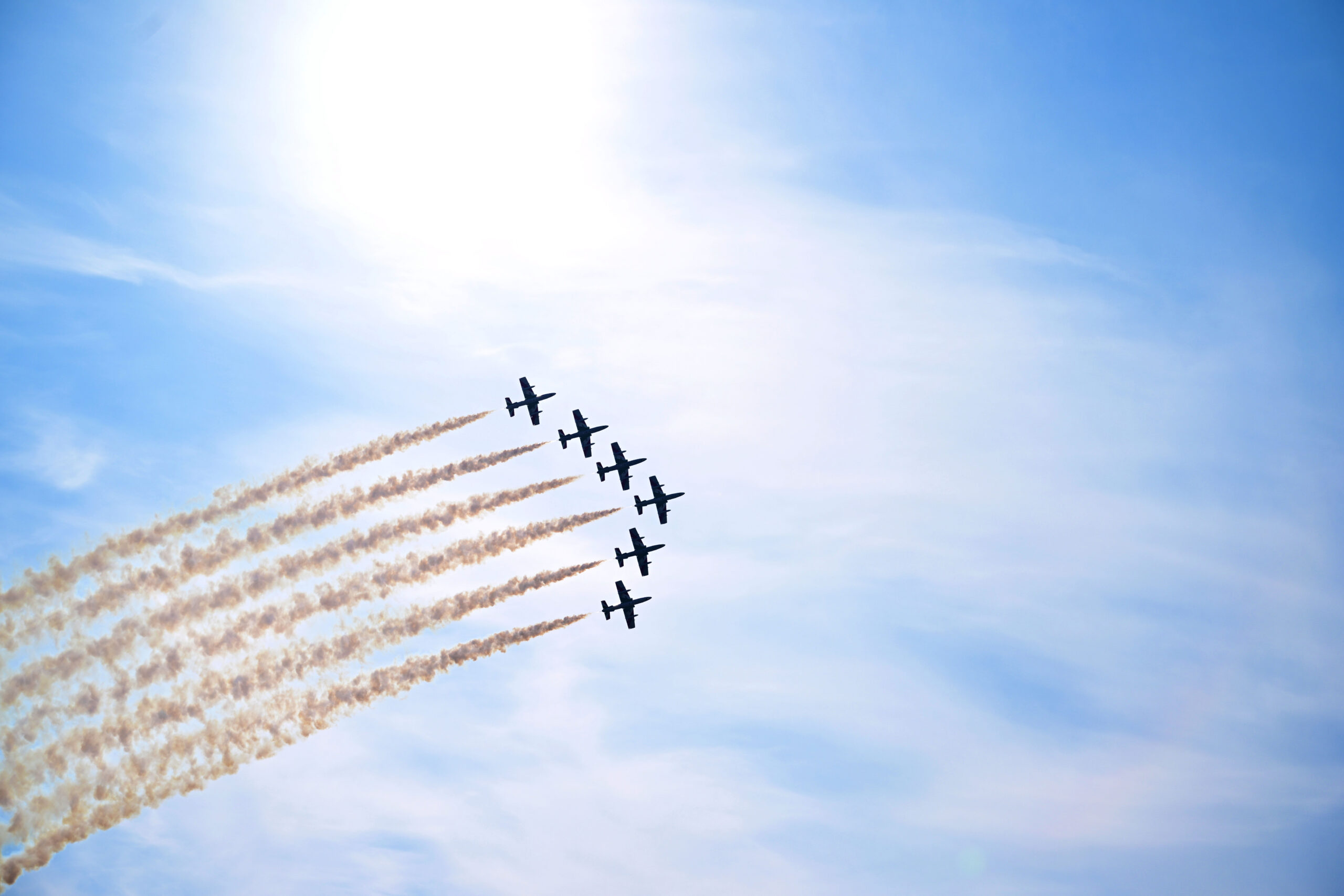 Frecce Tricolori display team flying in formation with smoke trails