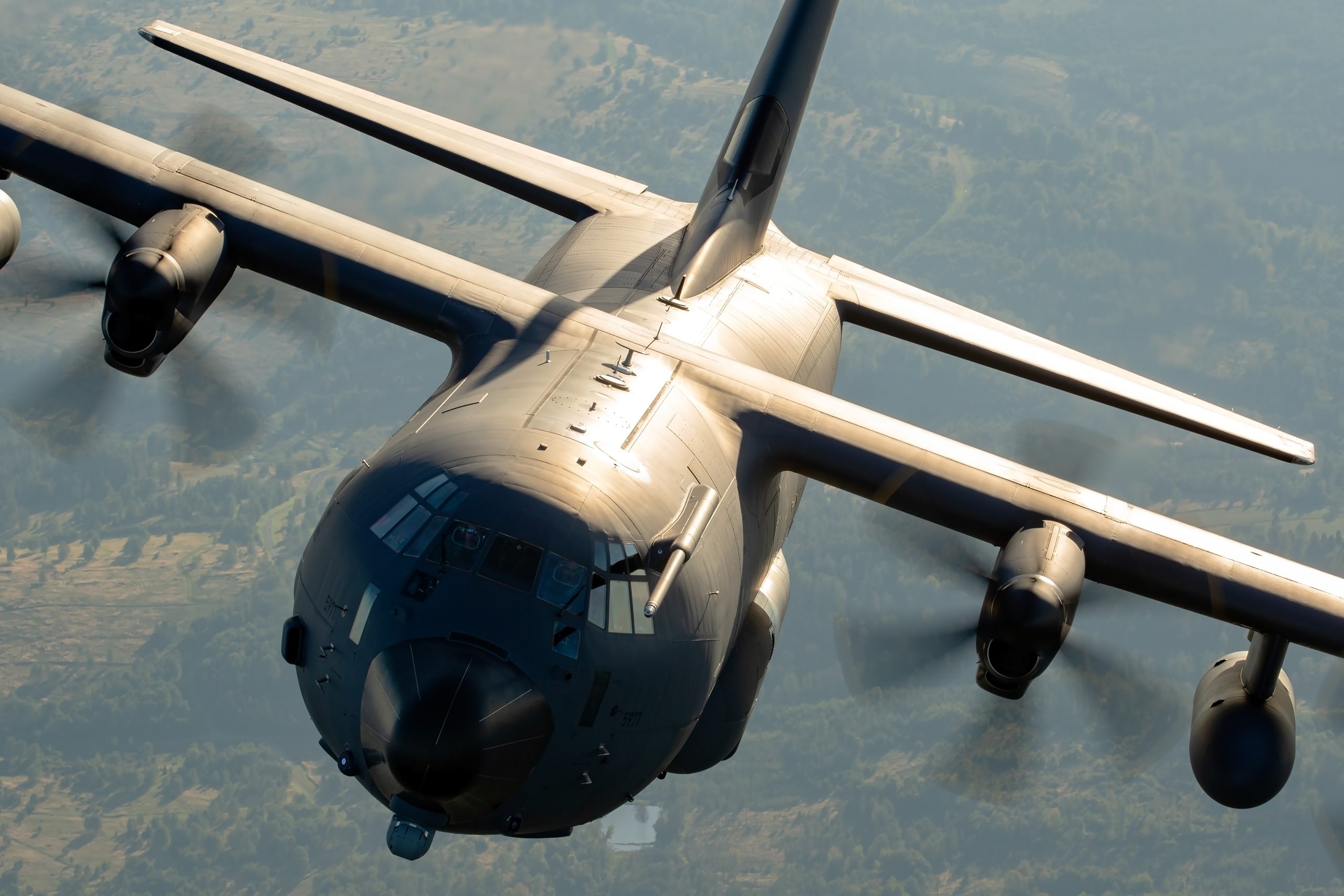 German Air Force KC-130J Hercules over a dramatic cloud deck