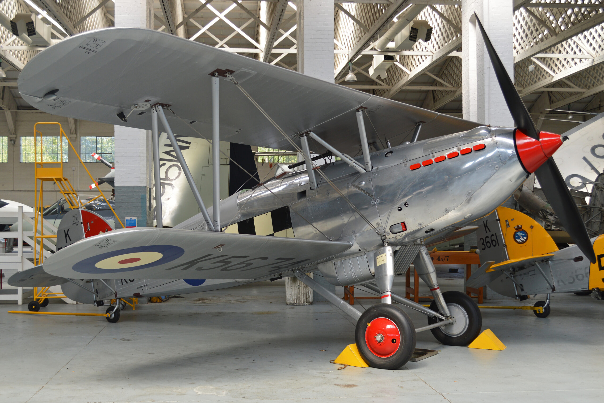 Hawker Fury I biplane fighter in silver RAF finish flying at an airshow