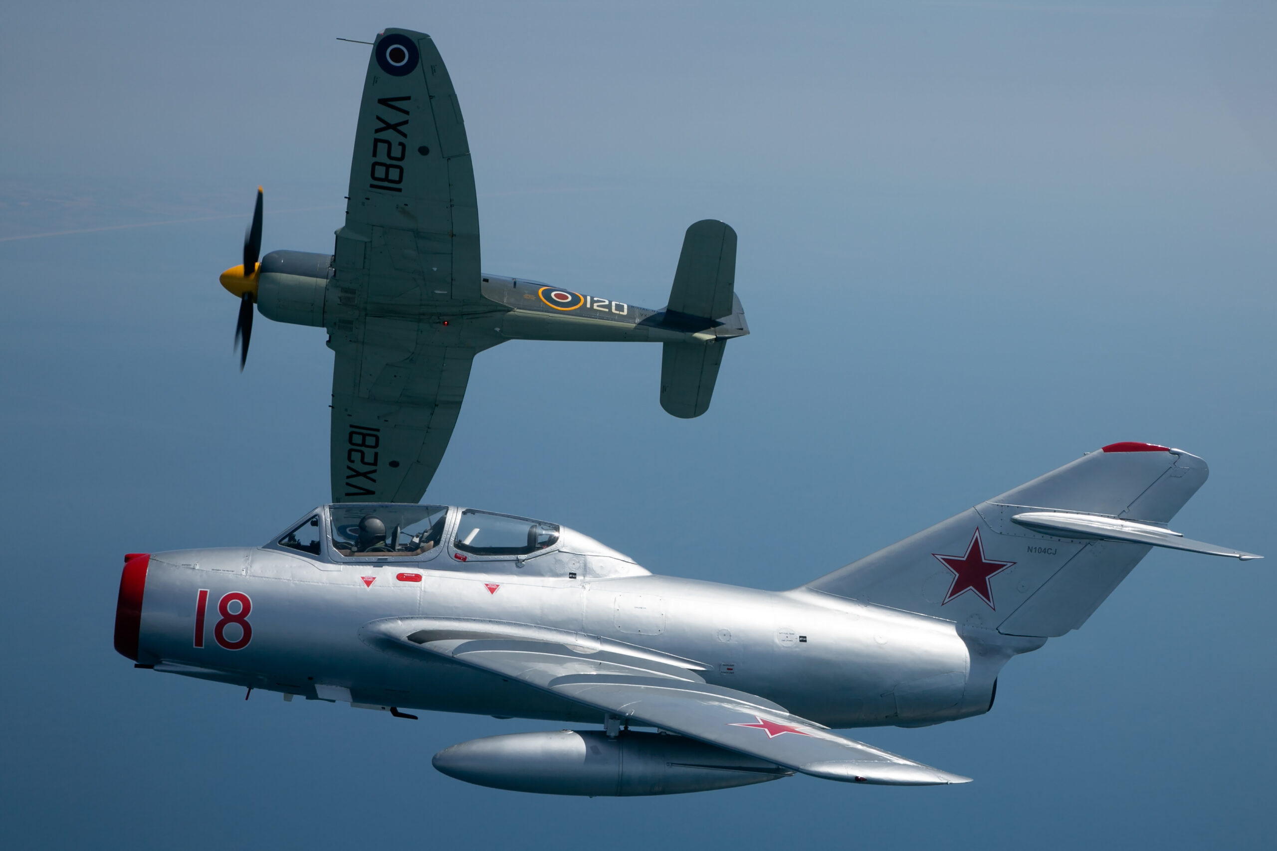 Royal Navy Historic Flight Hawker Sea Fury in formation with a MiG-15