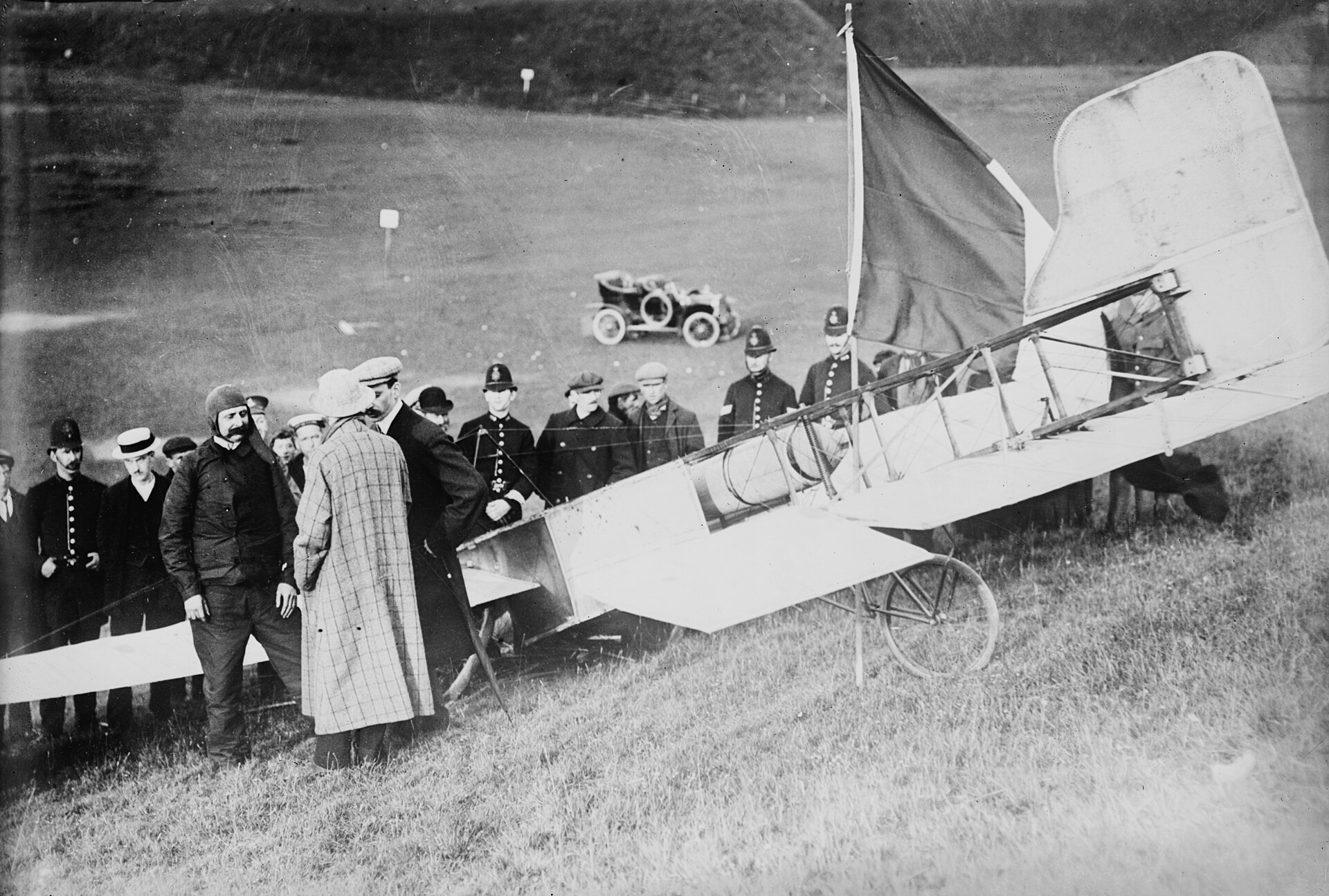 Louis Blériot standing beside his Blériot XI monoplane after the first aeroplane crossing of the English Channel on 25 July 1909