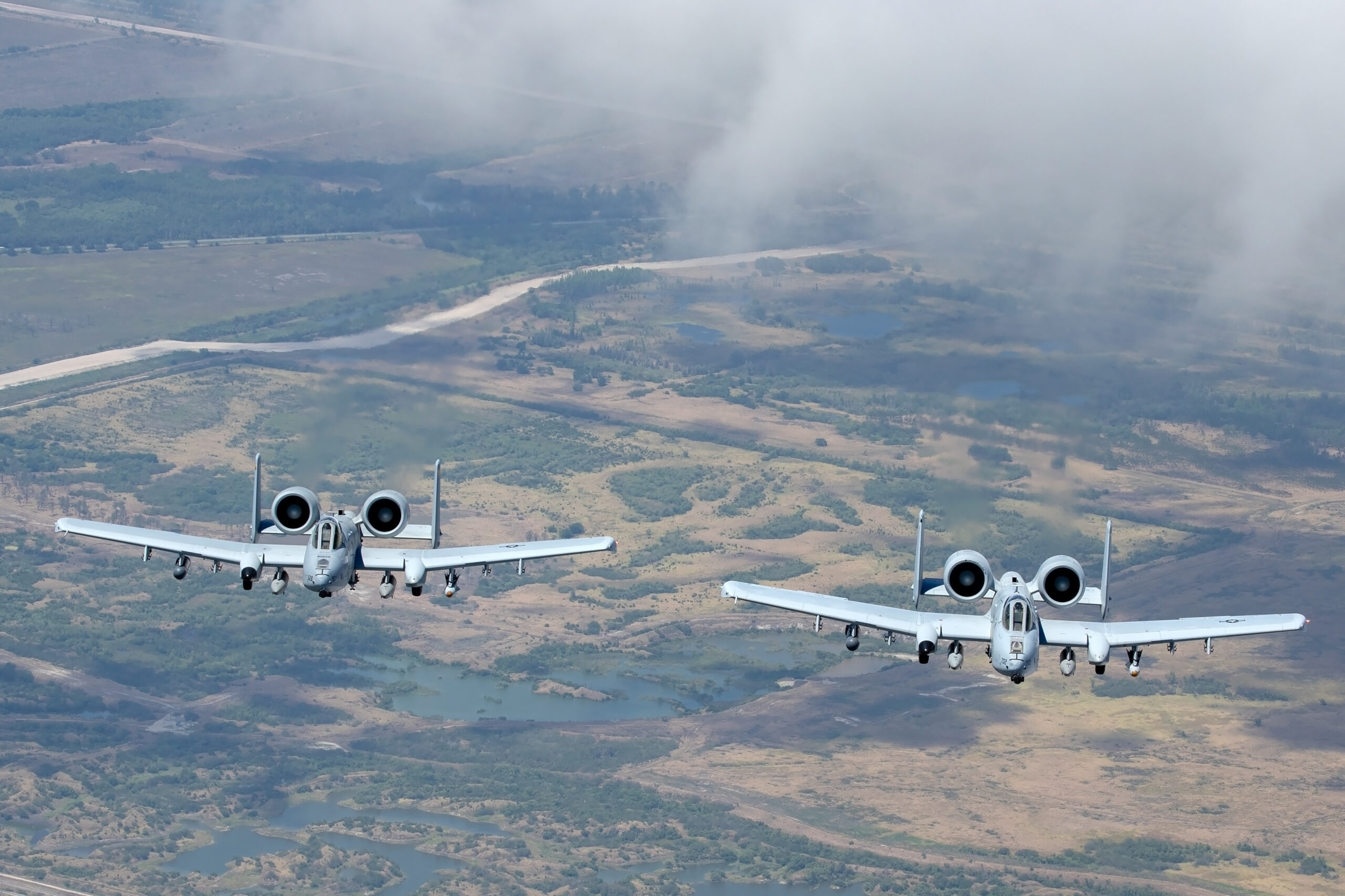 Two Maryland ANG A-10Cs head-on in loose formation over Florida ranchland
