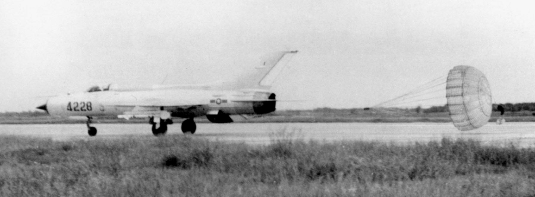 A North Vietnamese Air Force MiG-21 landing with its brake parachute deployed