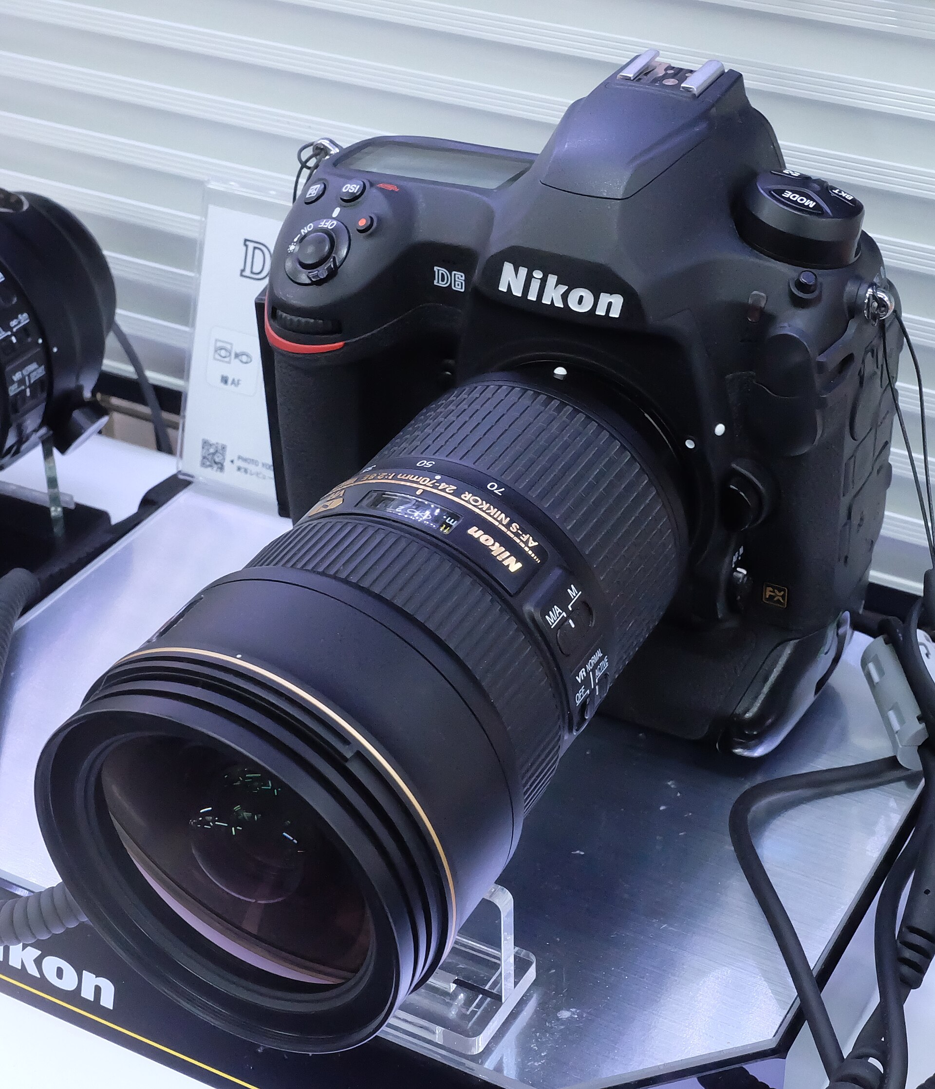 Nikon D6 flagship DSLR with telephoto lens on display
