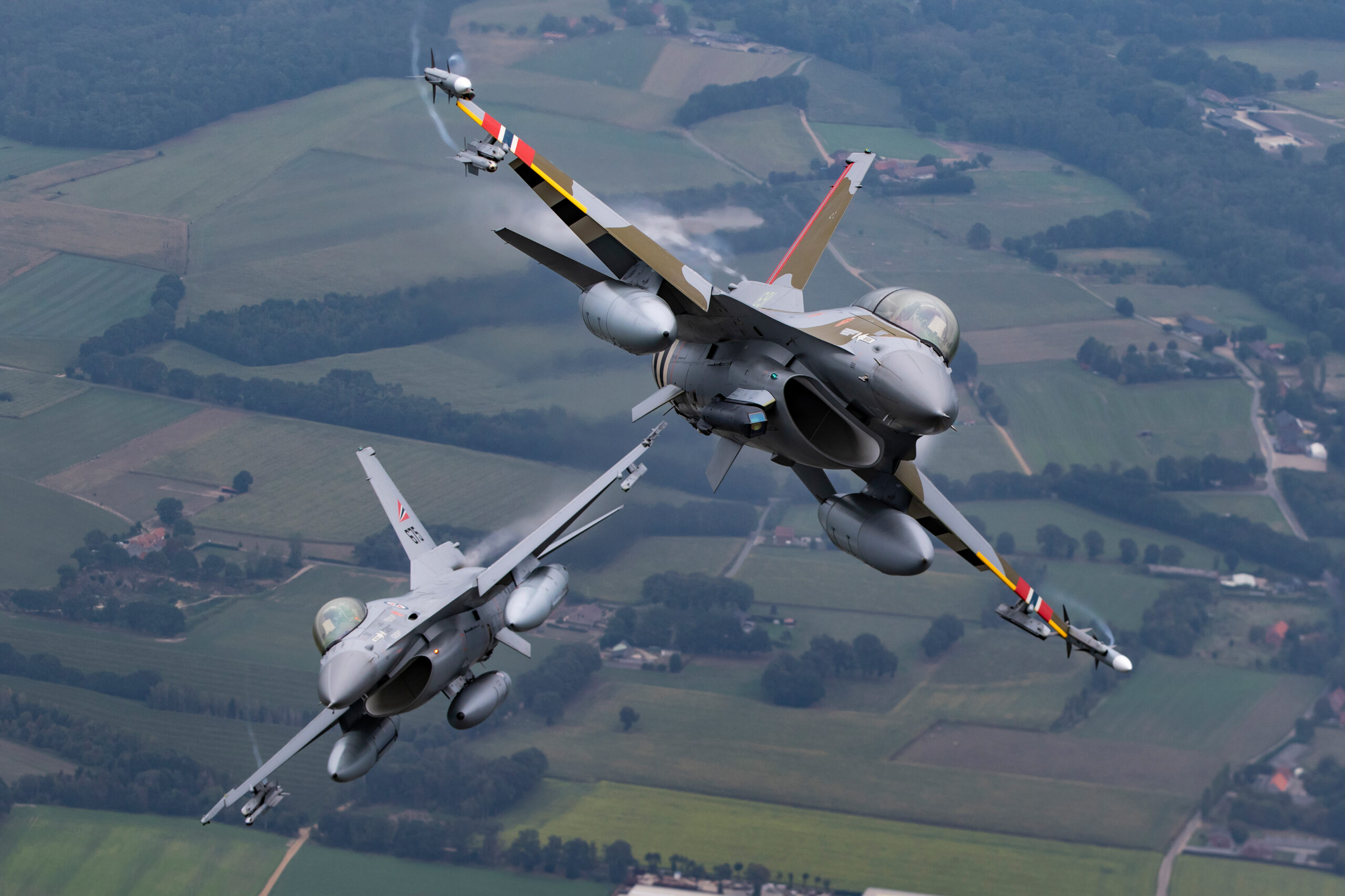 Two Royal Norwegian Air Force F-16s in formation air to air