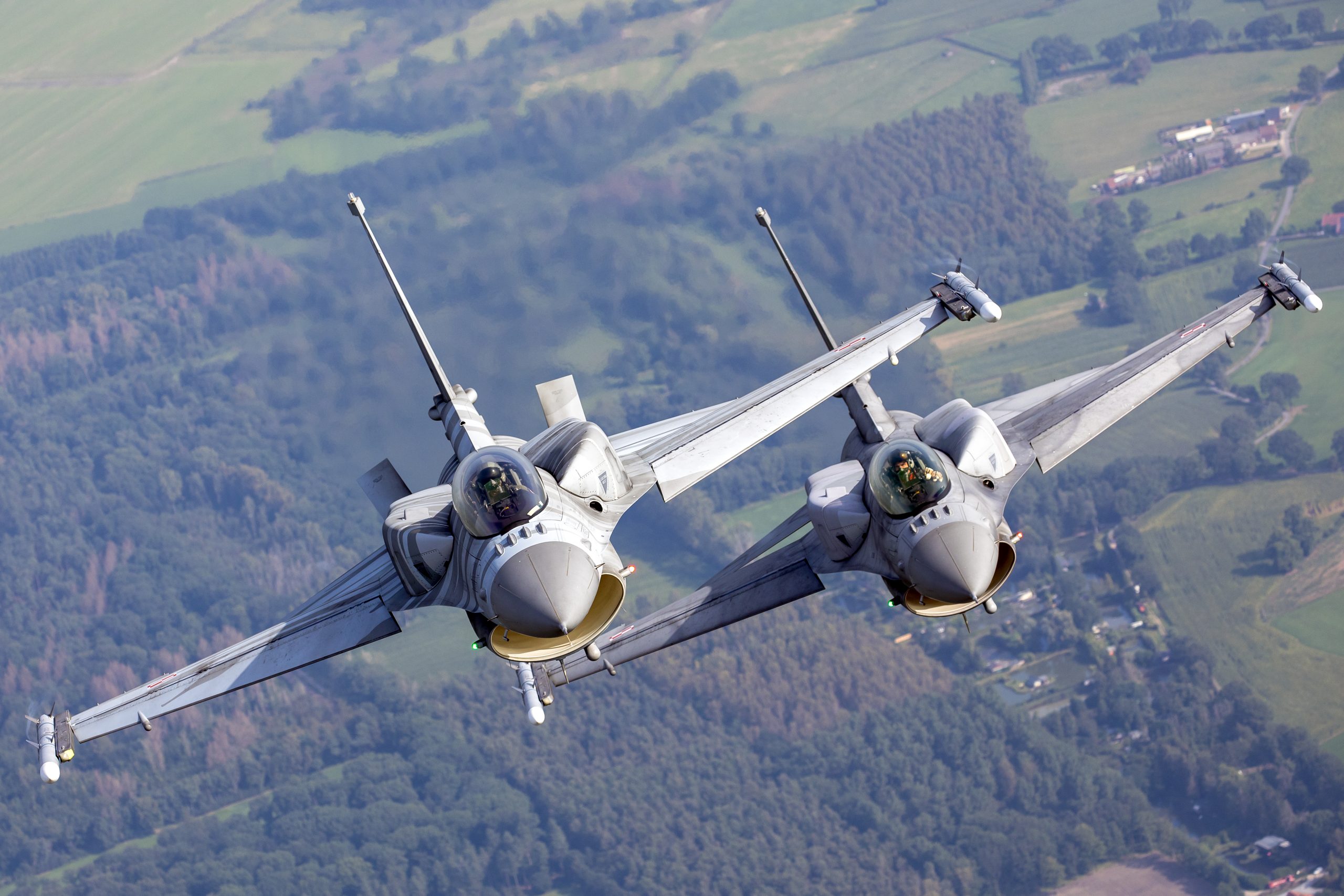 Two Polish Air Force F-16s in close formation, air to air