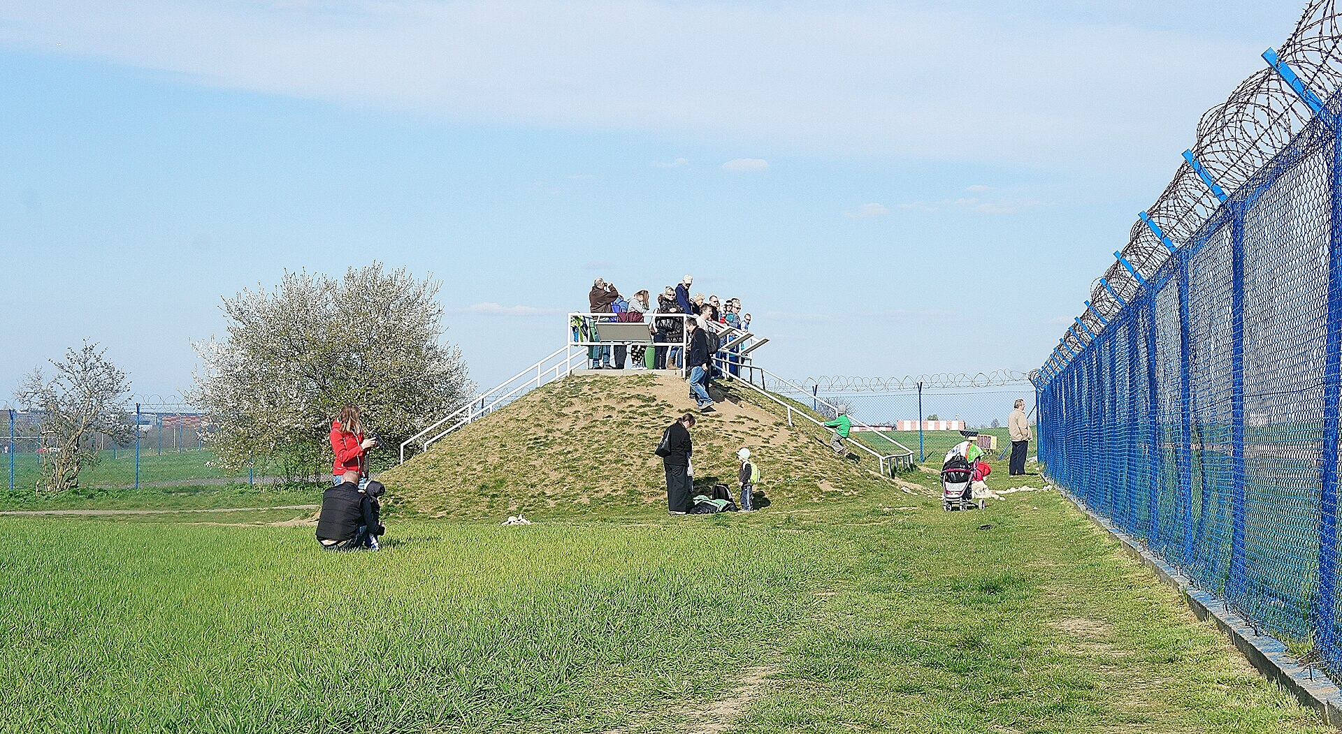 Purpose-built earthwork spotting mound for plane spotters at Václav Havel Airport Prague near Kněževes