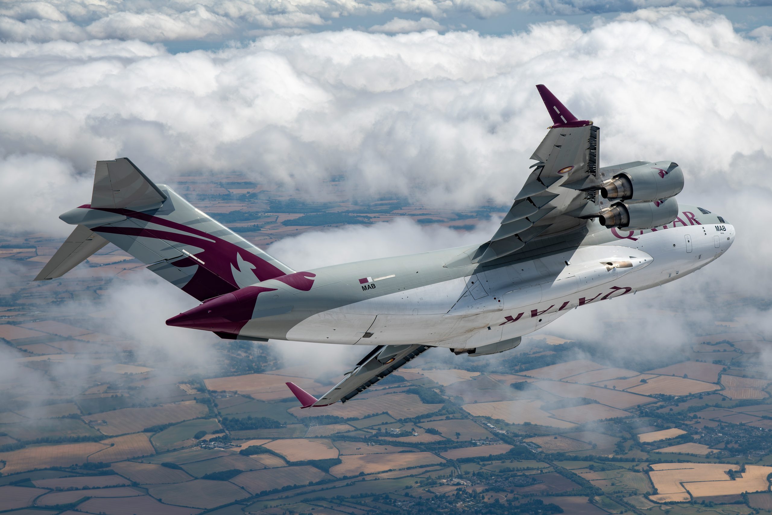 Qatar Emiri Air Force C-17 Globemaster III banking steeply over countryside at RIAT