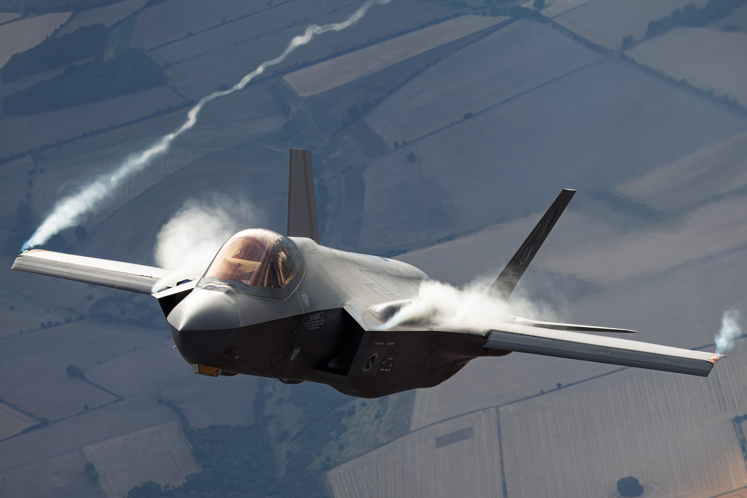 USAF F-35A Lightning II pulling vapour off the wings, air to air at RIAT