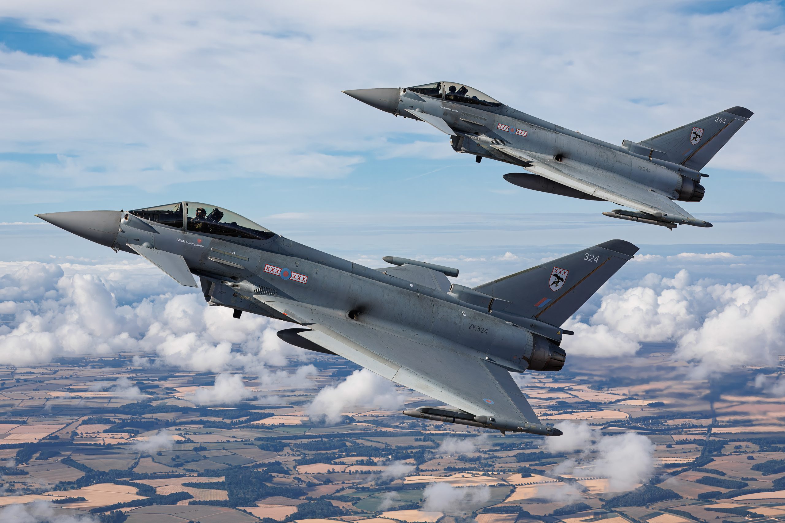 Two Royal Air Force Eurofighter Typhoon FGR4 jets in close formation, air to air