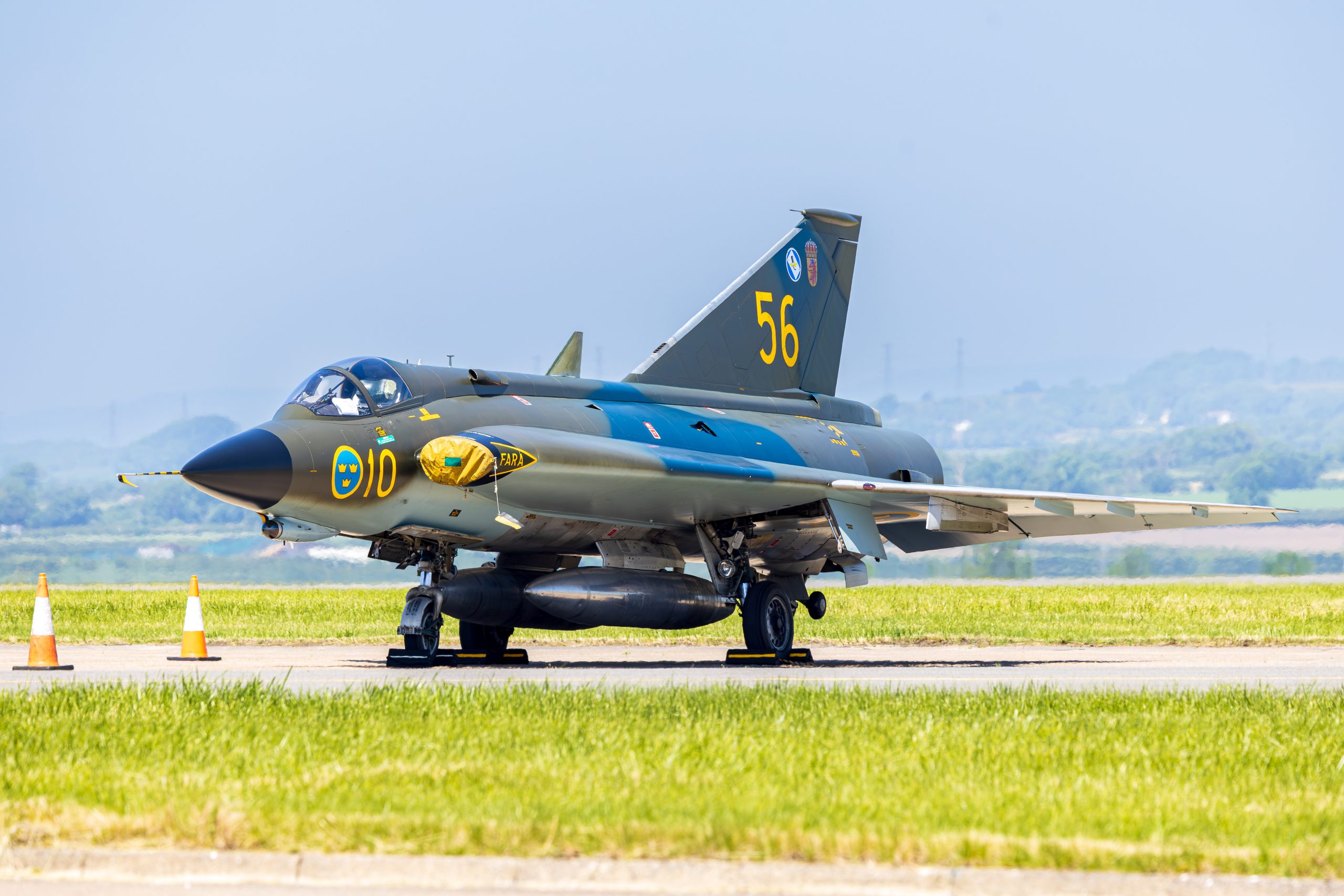 Saab J-35J Draken in Swedish camouflage parked on the ramp