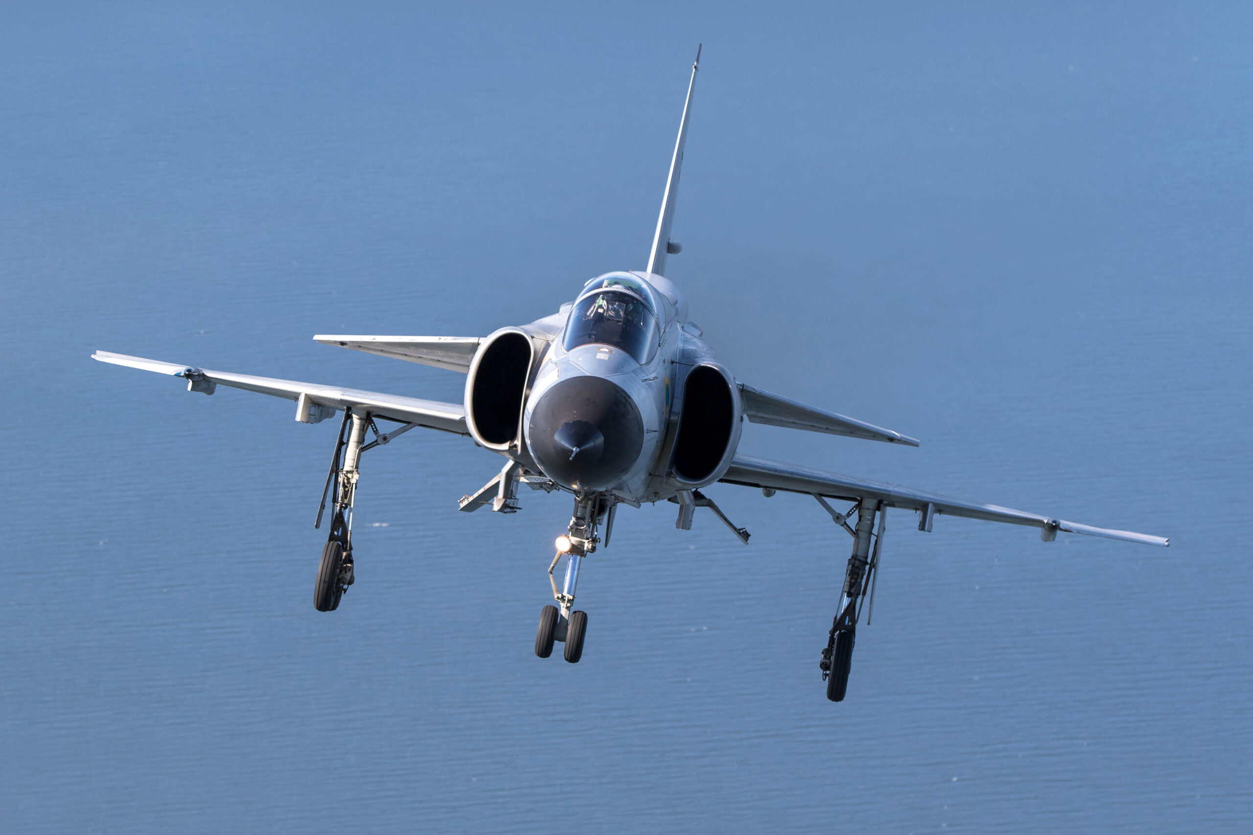 Saab AJS37 Viggen on approach with landing gear extended and landing light on