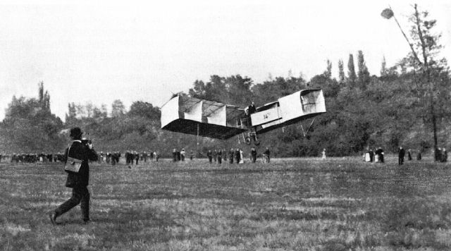 Alberto Santos-Dumont flying the 14-bis above the grass at Bagatelle, Paris, in November 1906