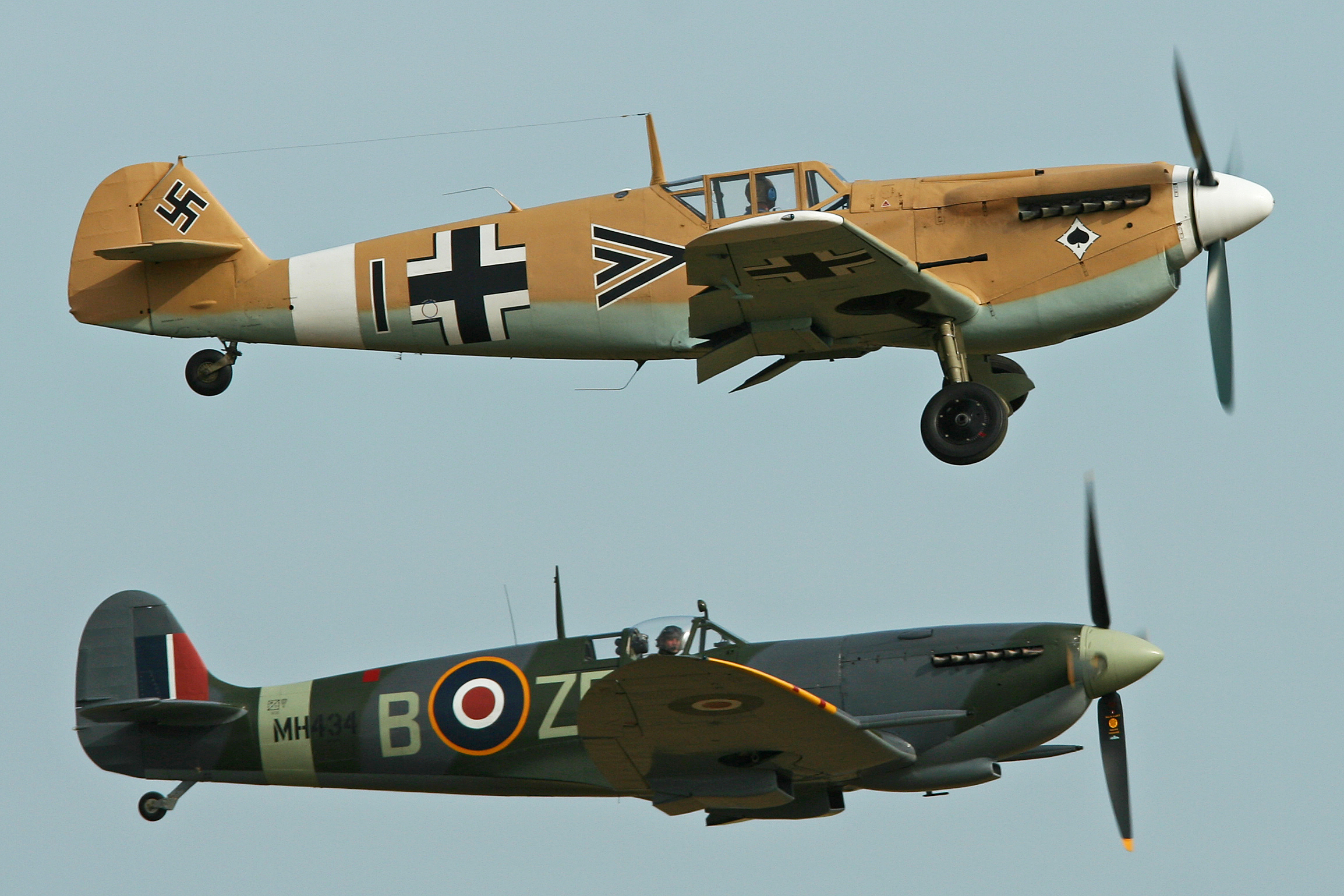A Spitfire and a Messerschmitt 109 getting airborne together at Flying Legends 2013