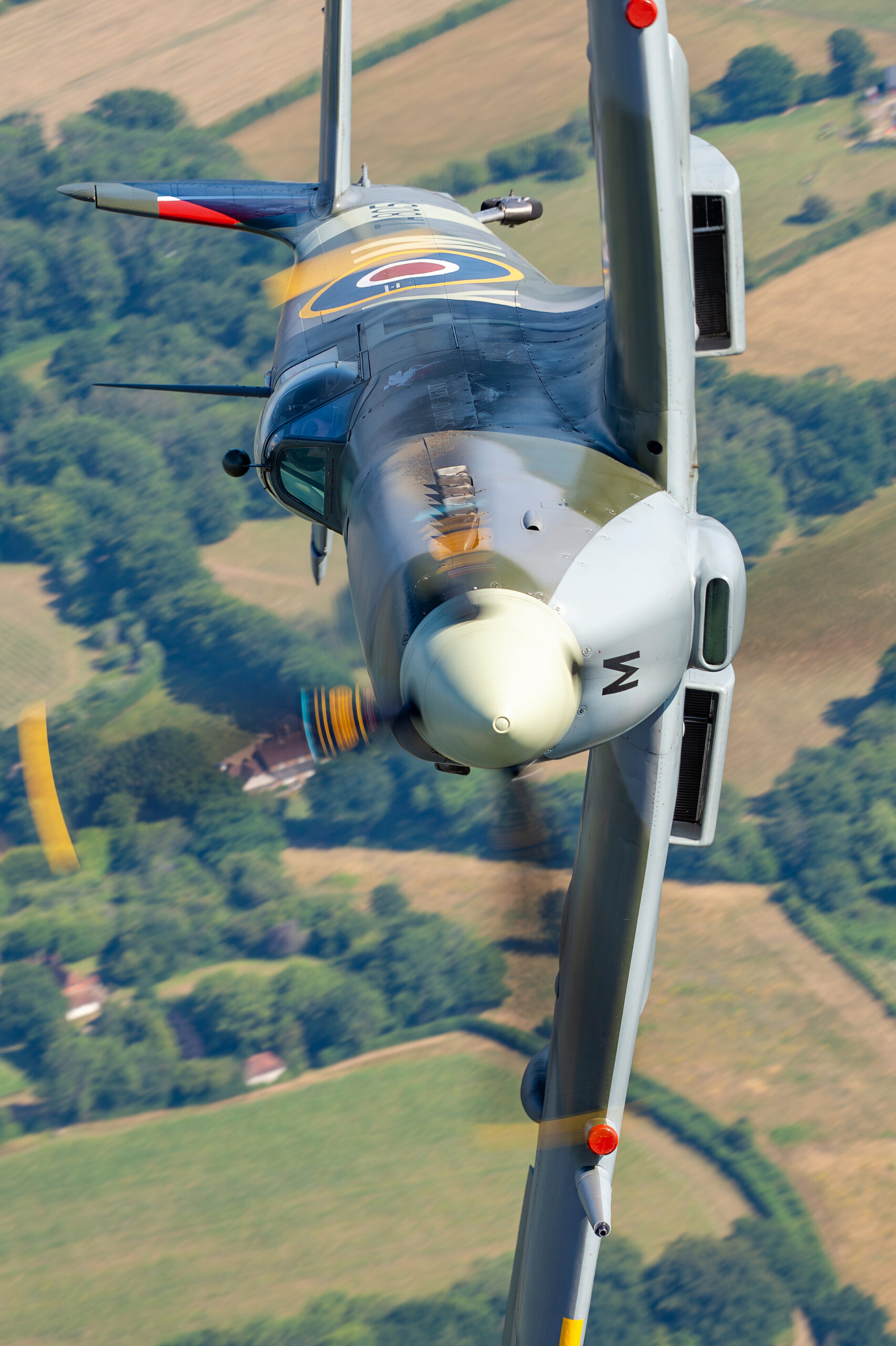 Spitfire HF9E TA805 close air-to-air with fully blurred propeller disc