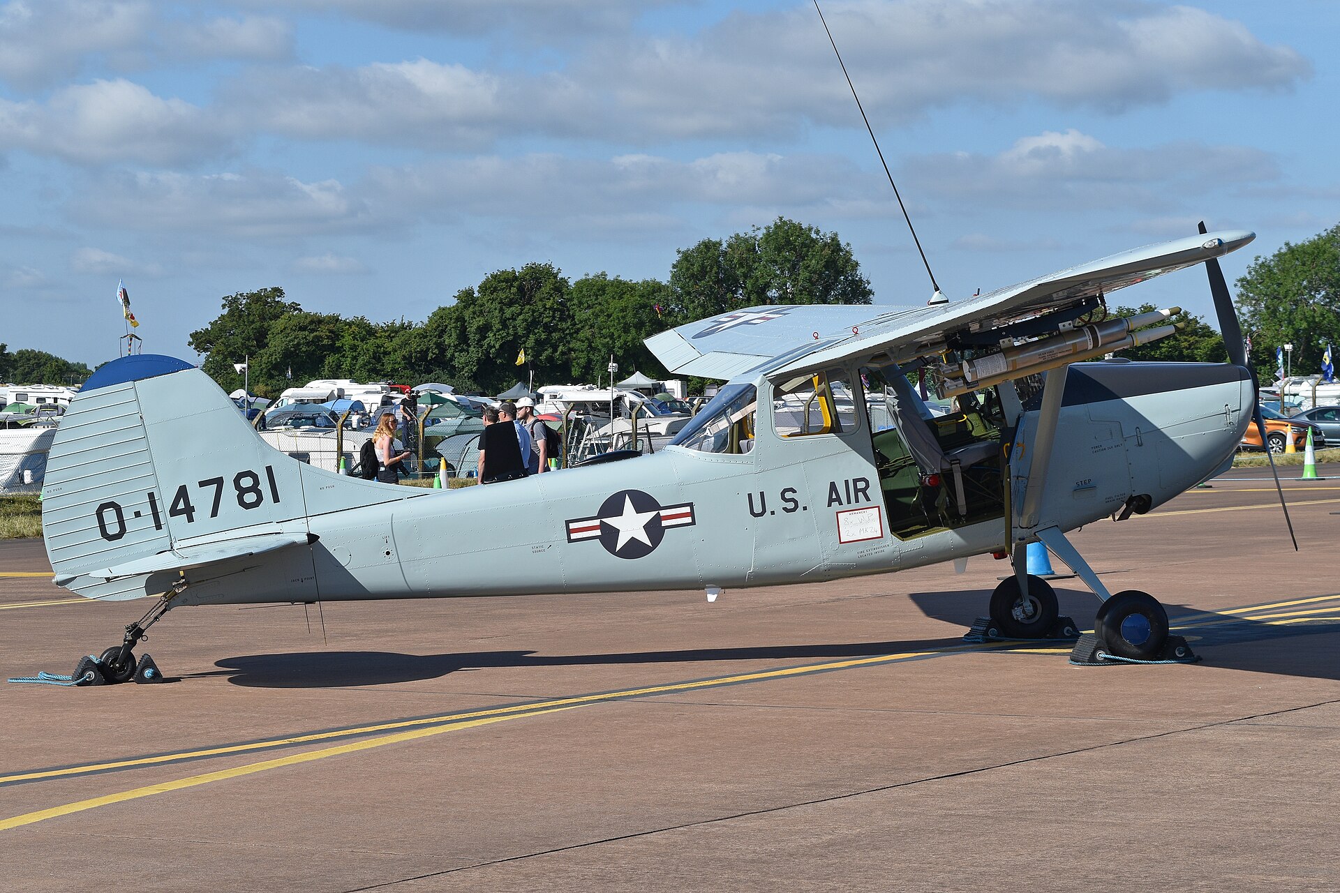 Light aircraft on static display with a crowd behind