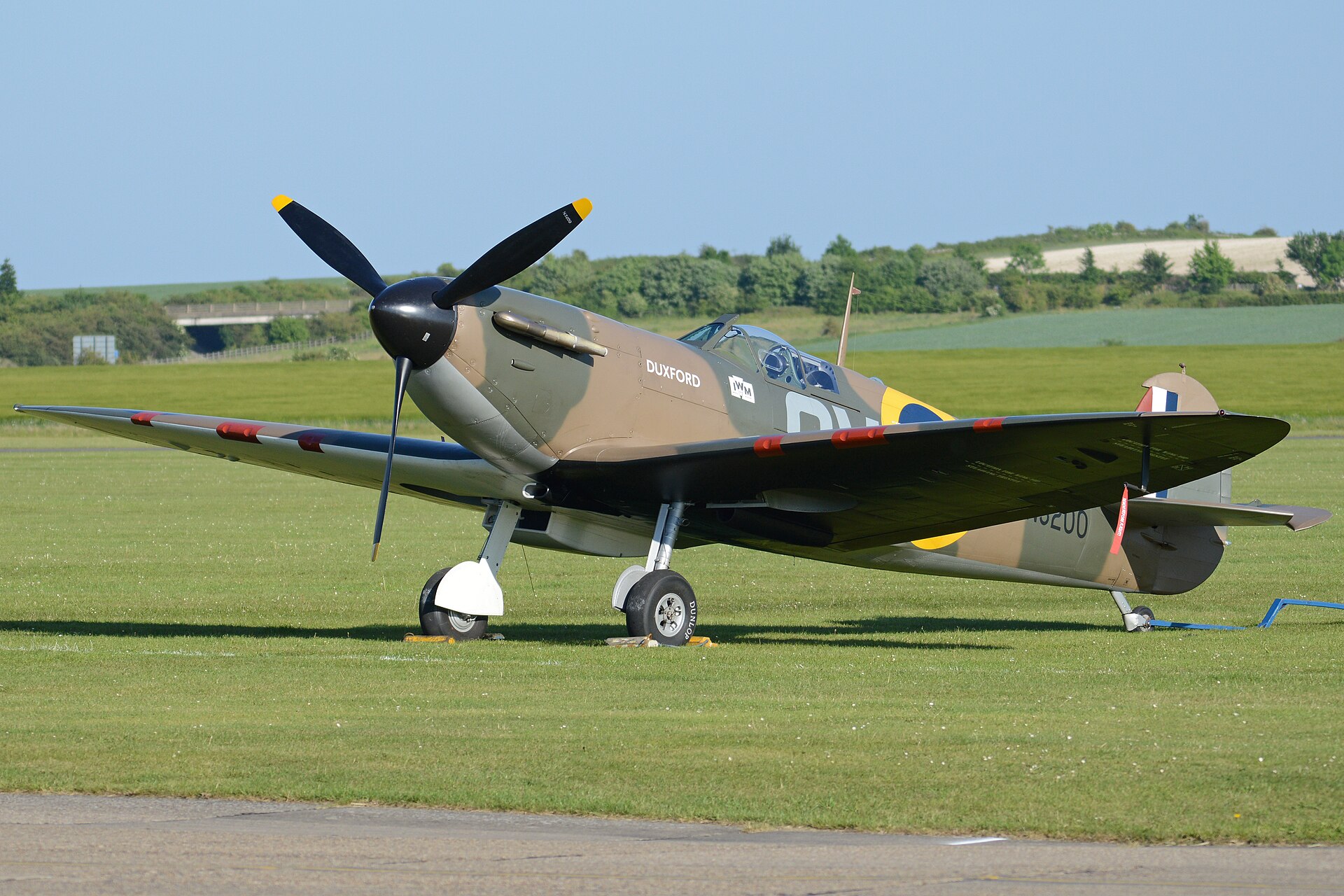 Supermarine Spitfire parked on grass, low angle