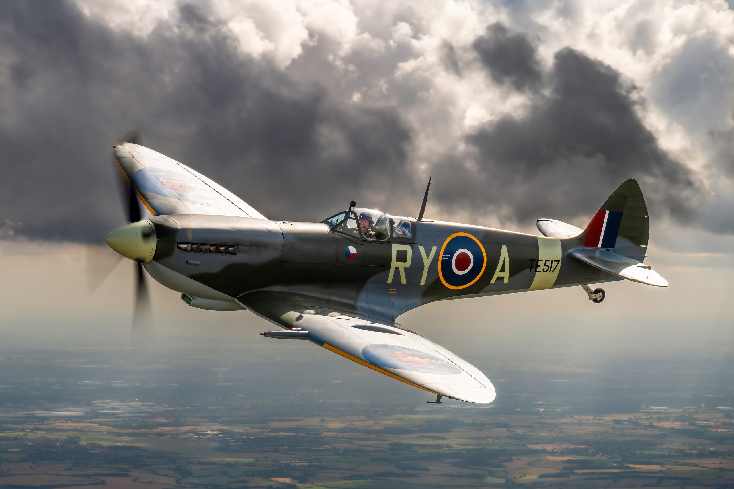 Supermarine Spitfire LF IXe TE517, coded RY-A, air to air against dramatic storm clouds