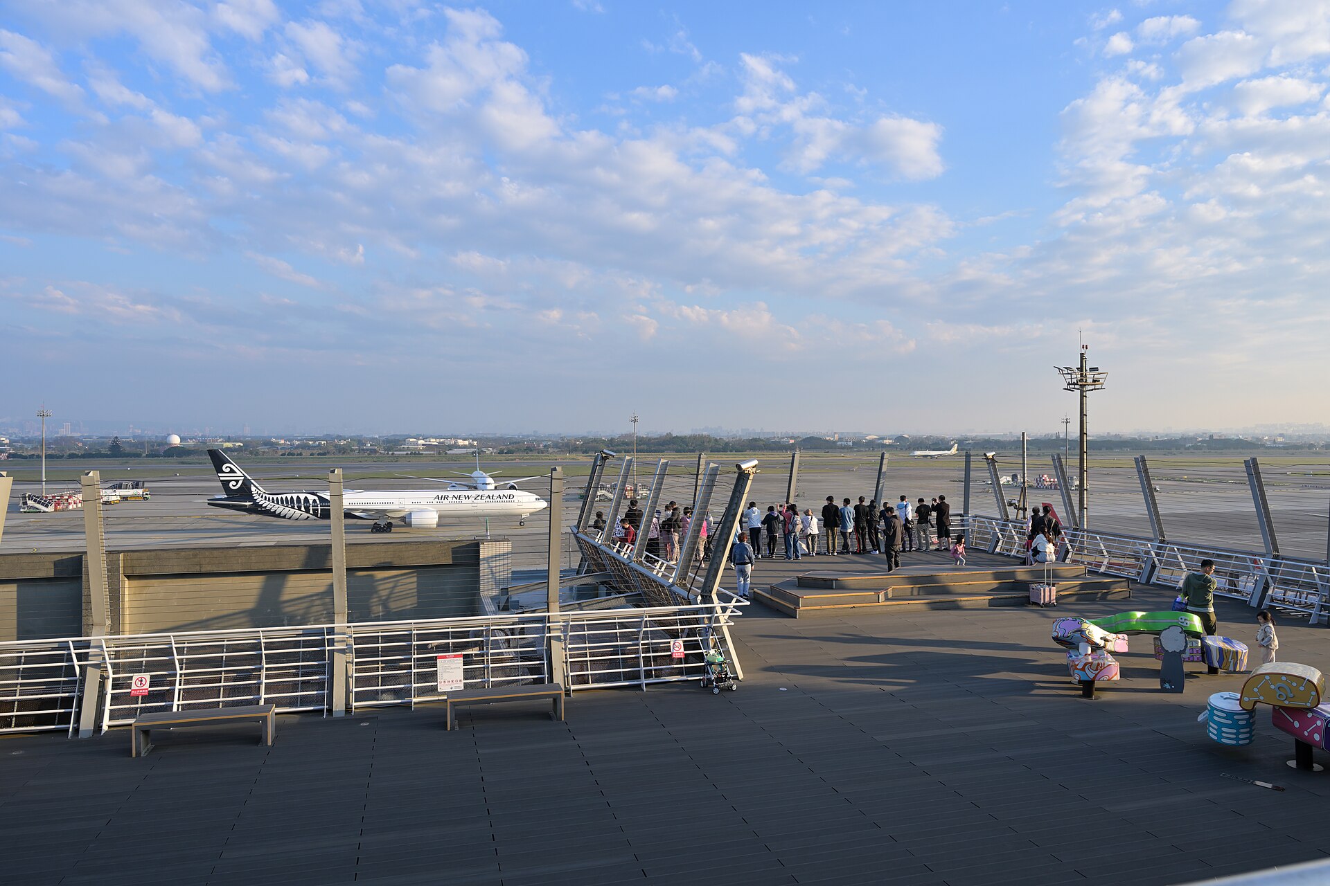 Planespotters watching aircraft from the north observation deck at Taiwan Taoyuan Airport