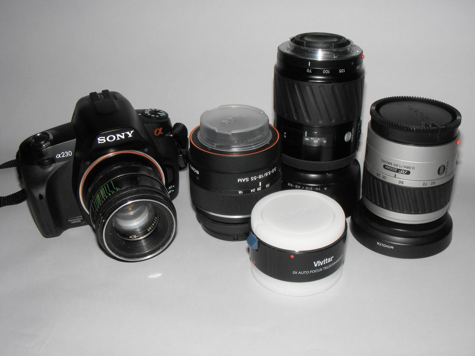 Telephoto zoom lenses beside a 2x teleconverter
