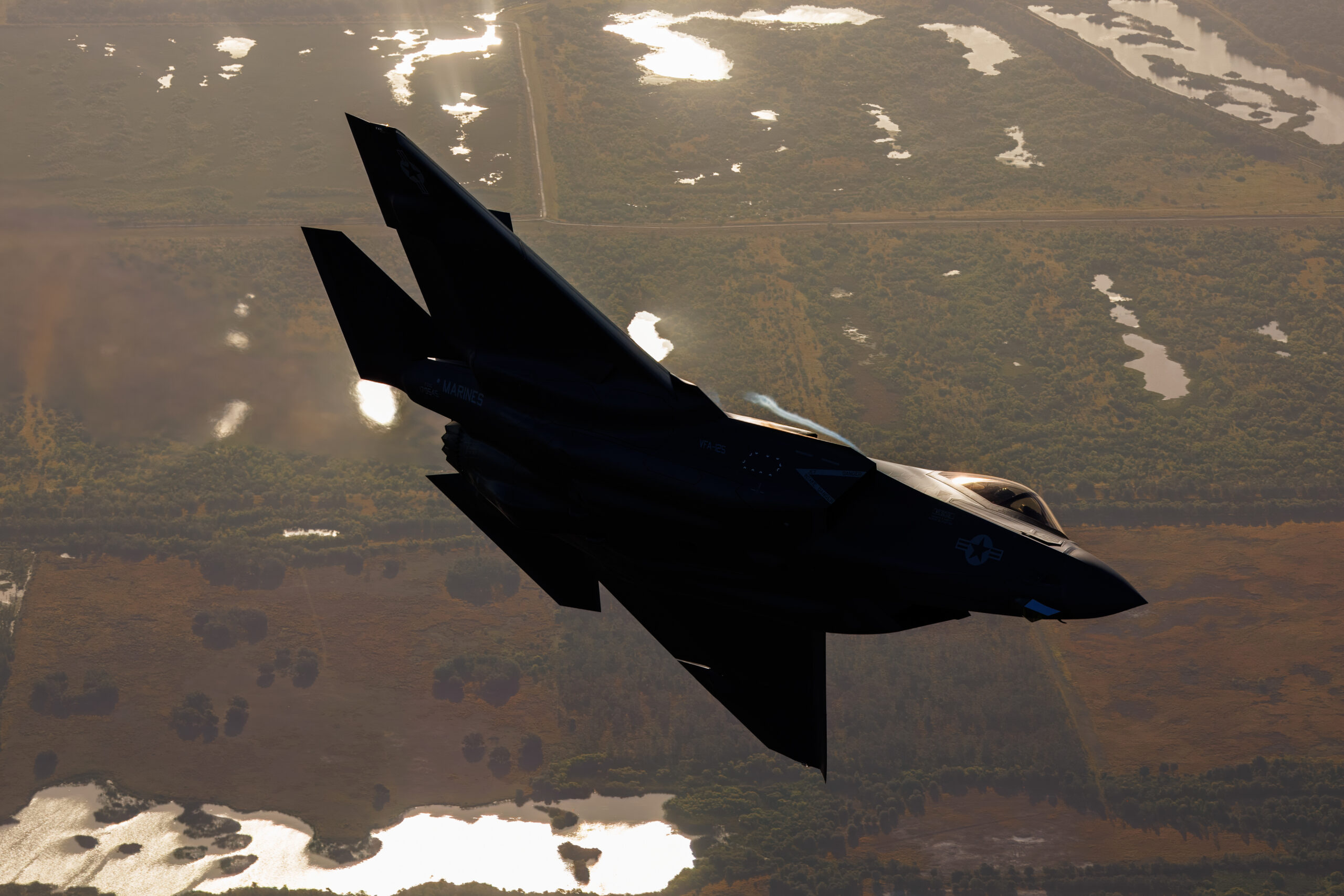 US Navy F-35C banking with its underside towards the camera