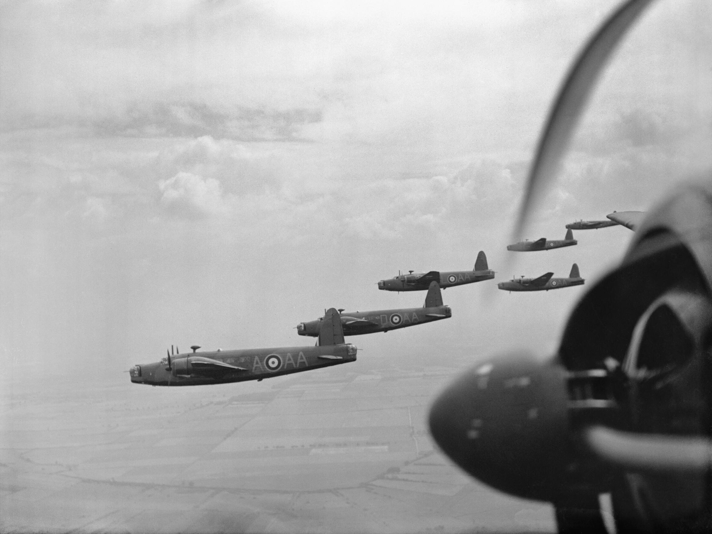 Vickers Wellington Mk IAs and ICs of No. 75 (NZ) Squadron RAF flying in loose formation over East Anglia