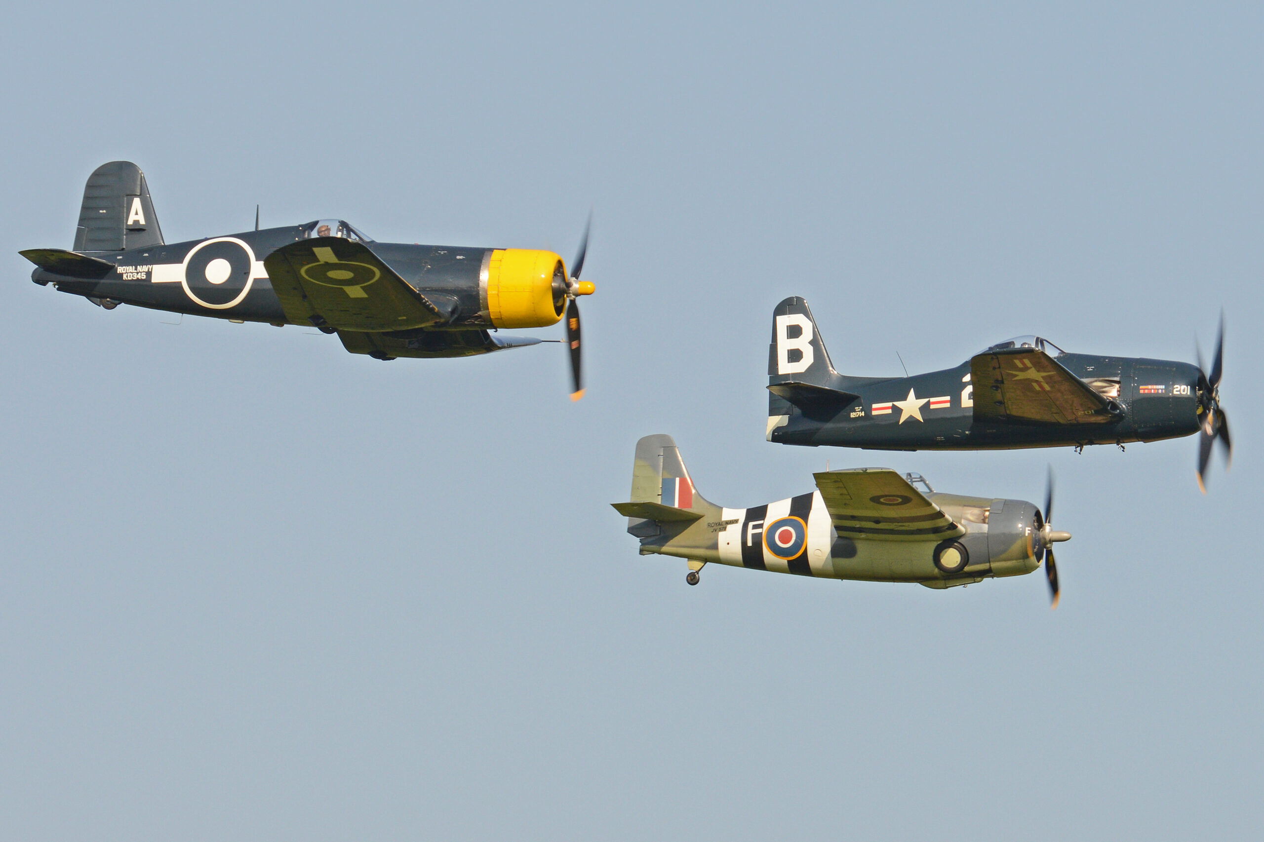 Wildcat, Bearcat and Corsair warbirds flying in formation at the Fly Navy airshow, Old Warden